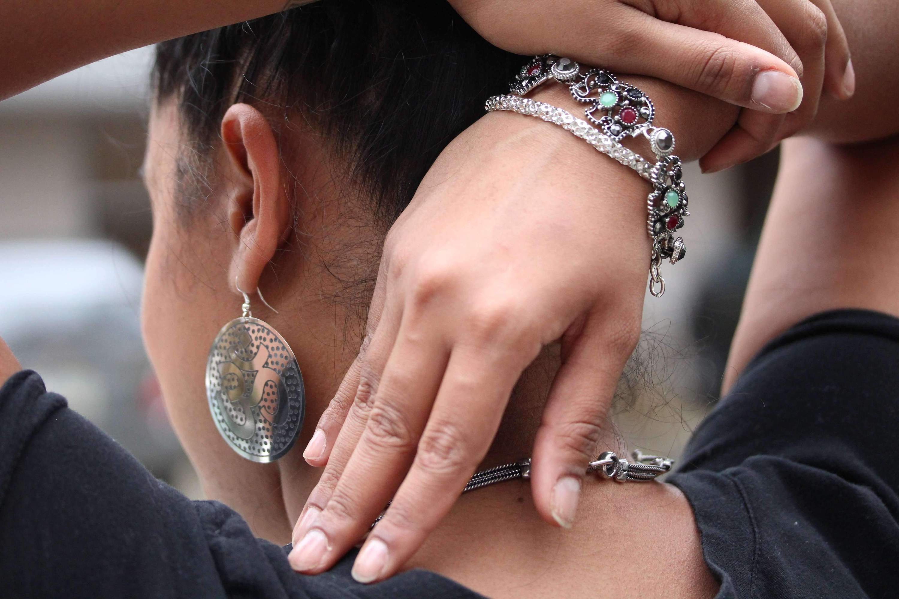 Elegant Grand Om Yoga Earrings in silver and gold tones featuring a prominent OM symbol.