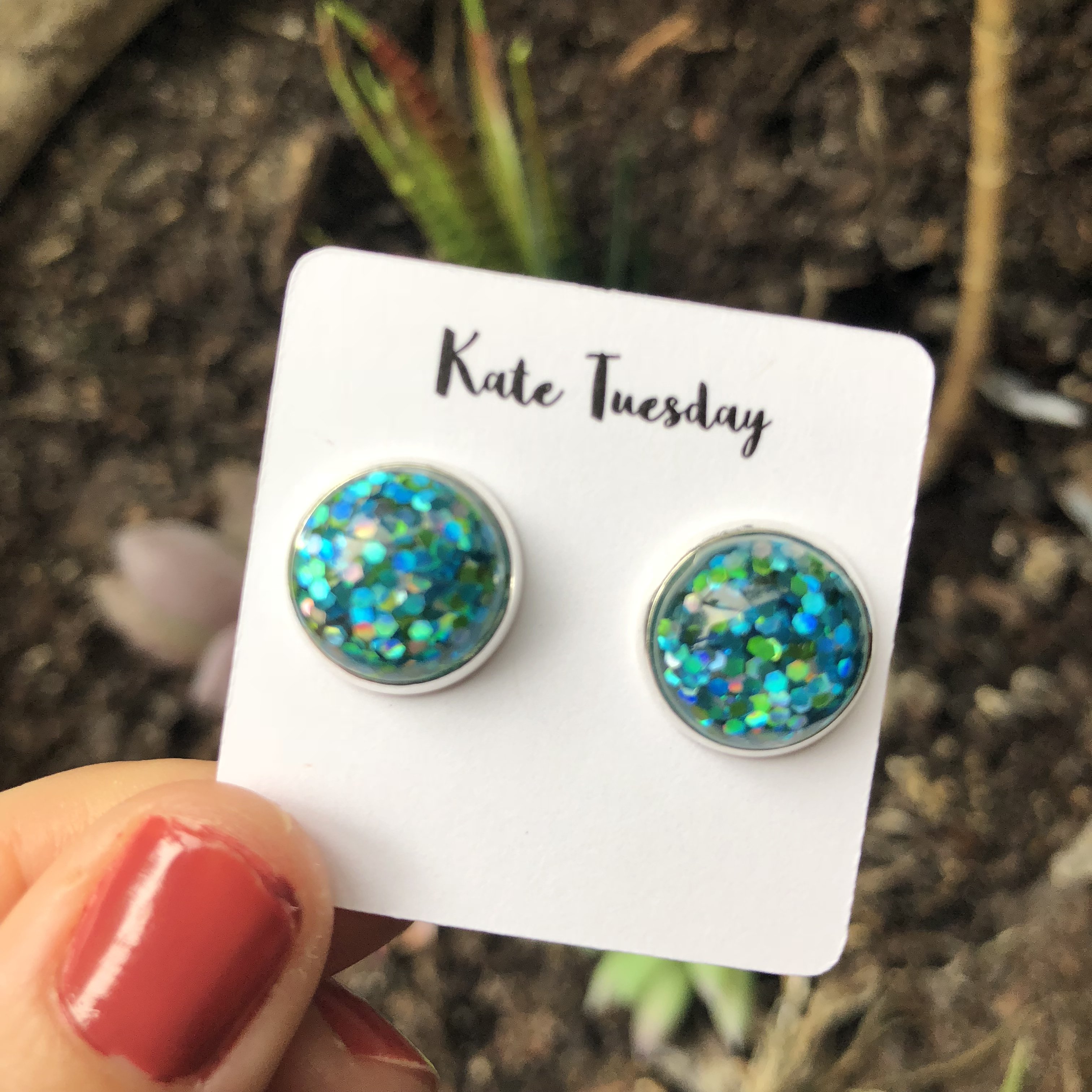 A pair of stunning Green Blue Glitter Earrings featuring vibrant colors and a sparkling finish, perfect for any occasion.