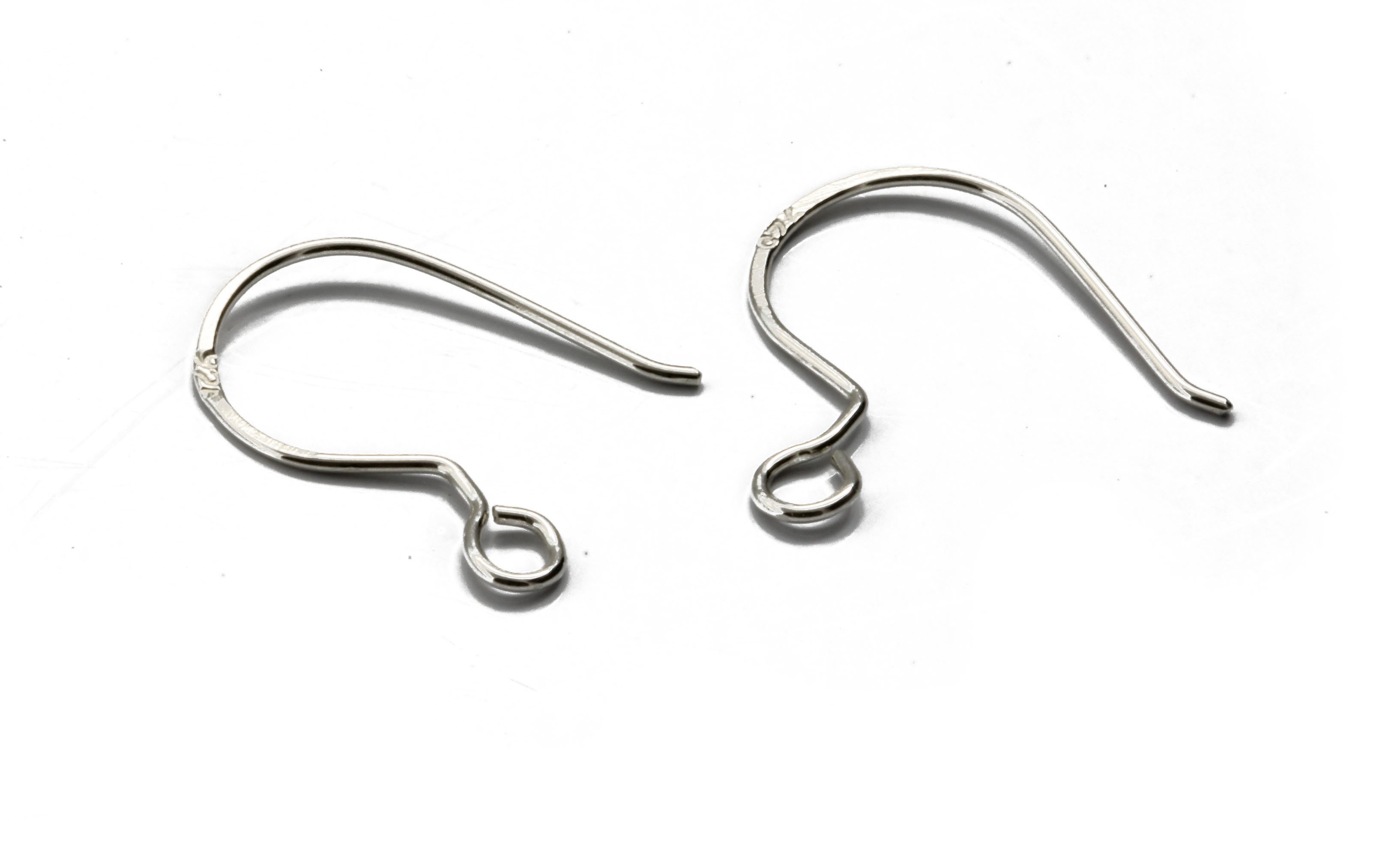 A pair of handcrafted fish hook ear wires made from Sterling Silver 925, featuring a simple loop design for easy wear and comfort.