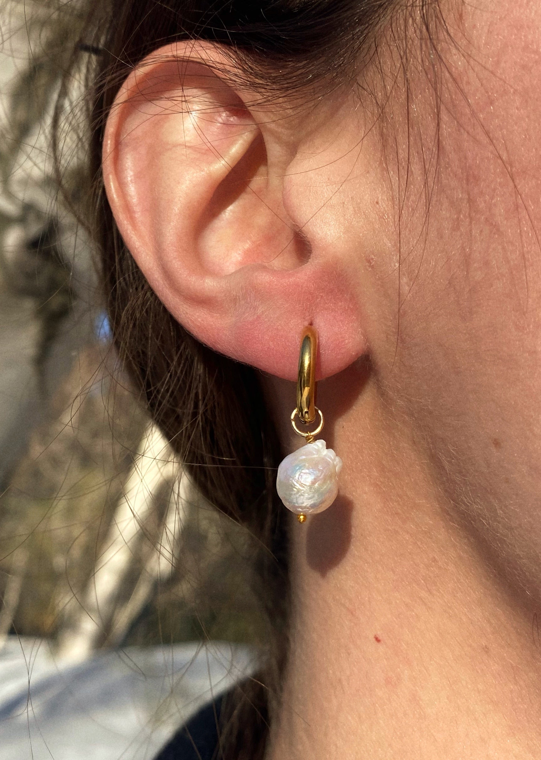 Elegant handcrafted Hoop Pearl Earrings made from steel and natural pearls, inspired by Sicilian archaeological artifacts.