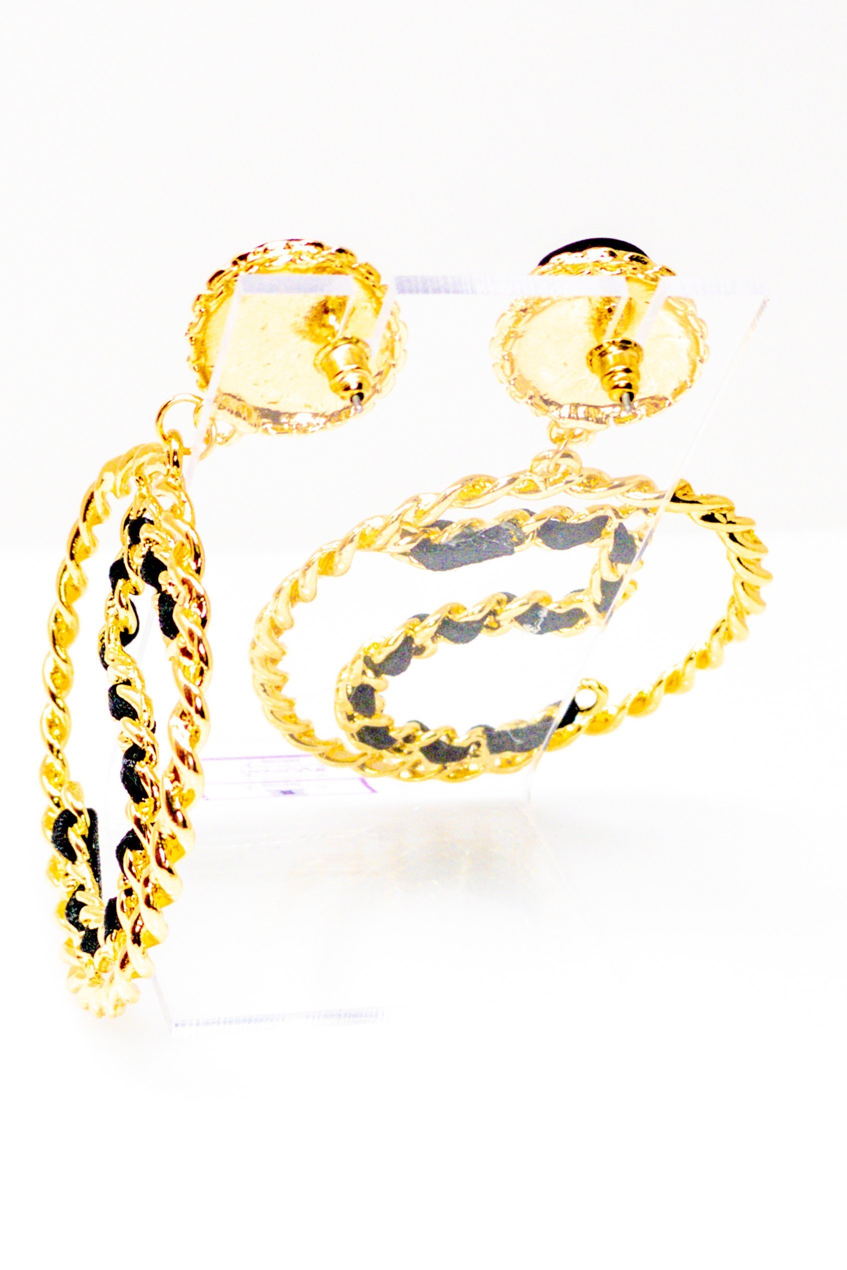 Elegant gold drop hoop earrings made from satin ribbon and brass, featuring a unique geometric design.