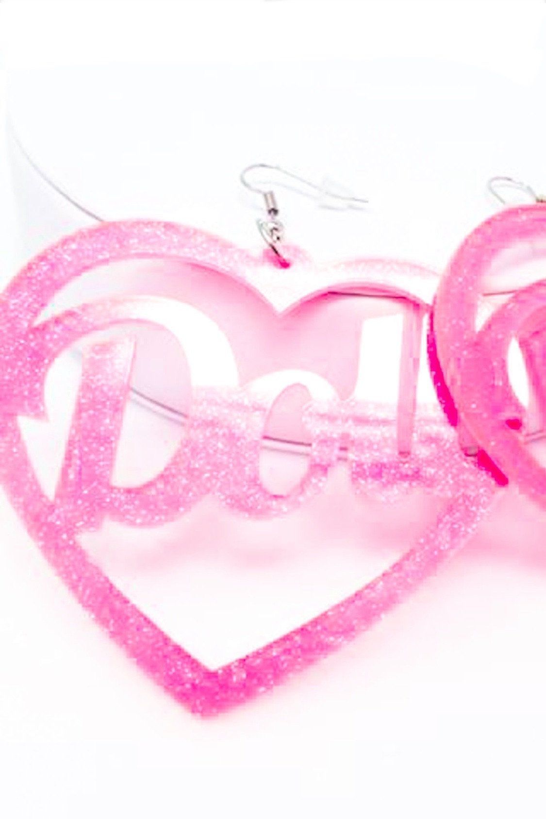 Hoops Doll Earrings featuring a vibrant pink color and sparkle drop design, made from high-quality acrylic.