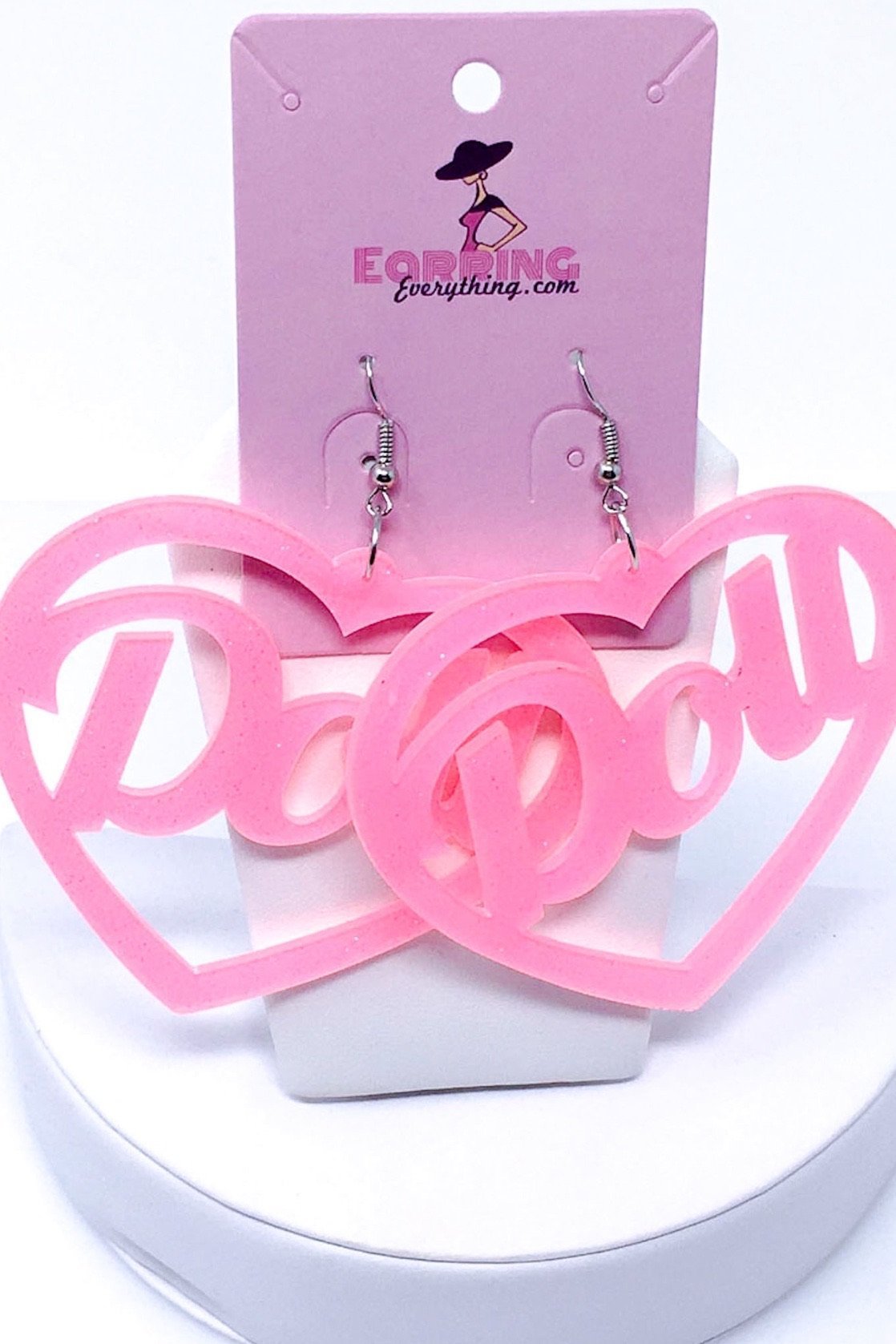 Hoops Doll Earrings featuring a vibrant pink color and sparkle drop design, made from high-quality acrylic.