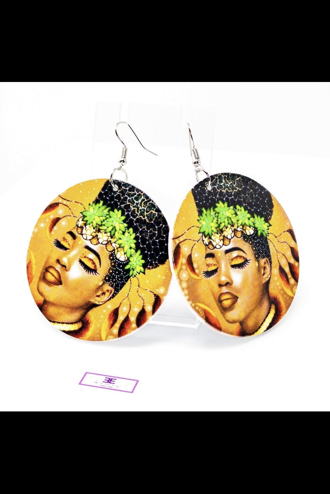 Circular earrings with woman's face.