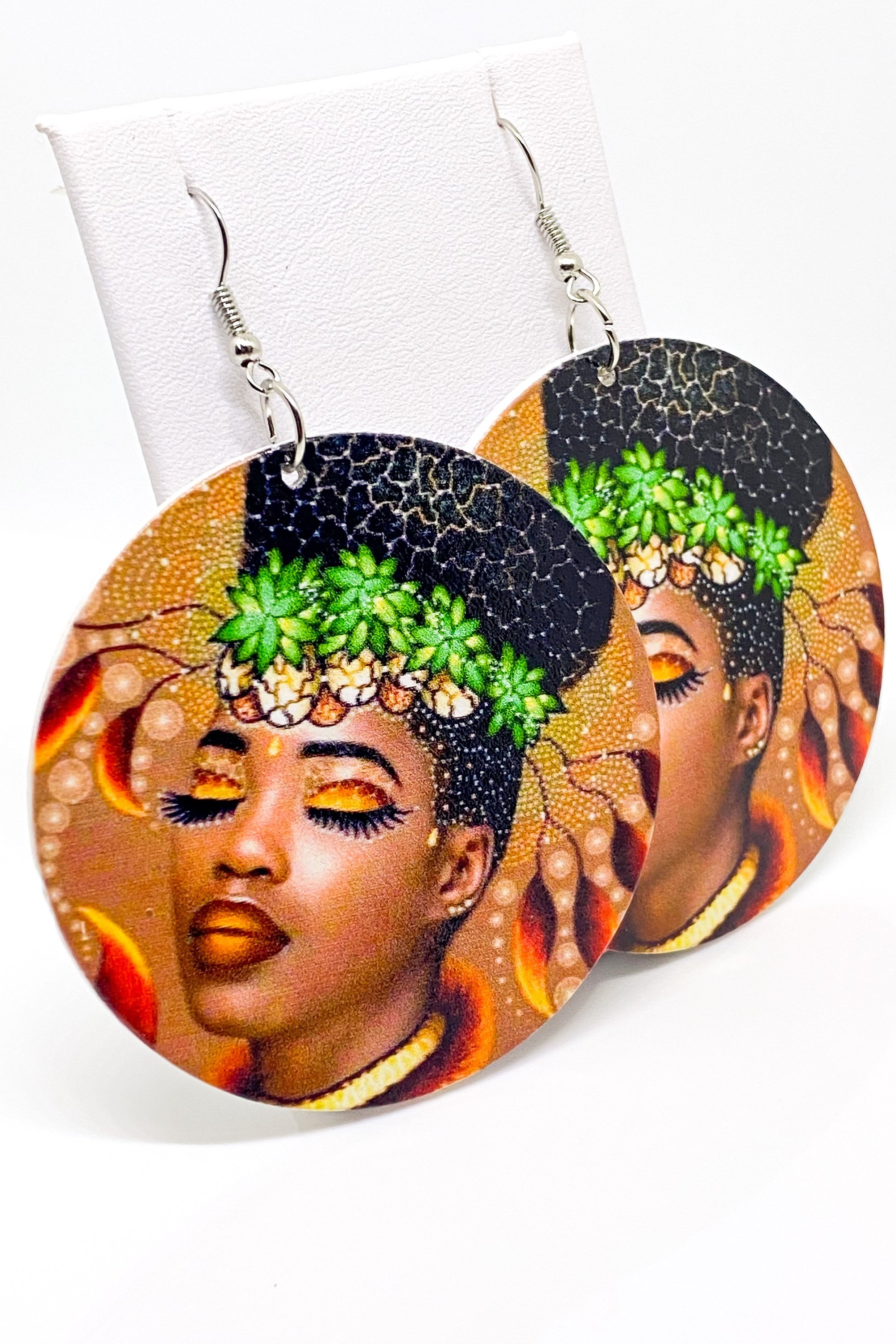 Round earrings with artistic face.