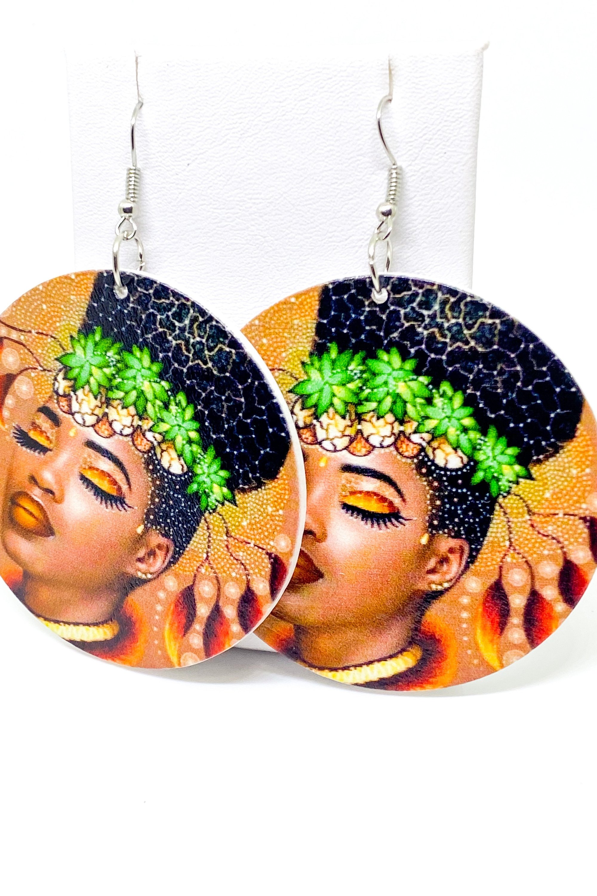 Circular earrings with woman's portrait.