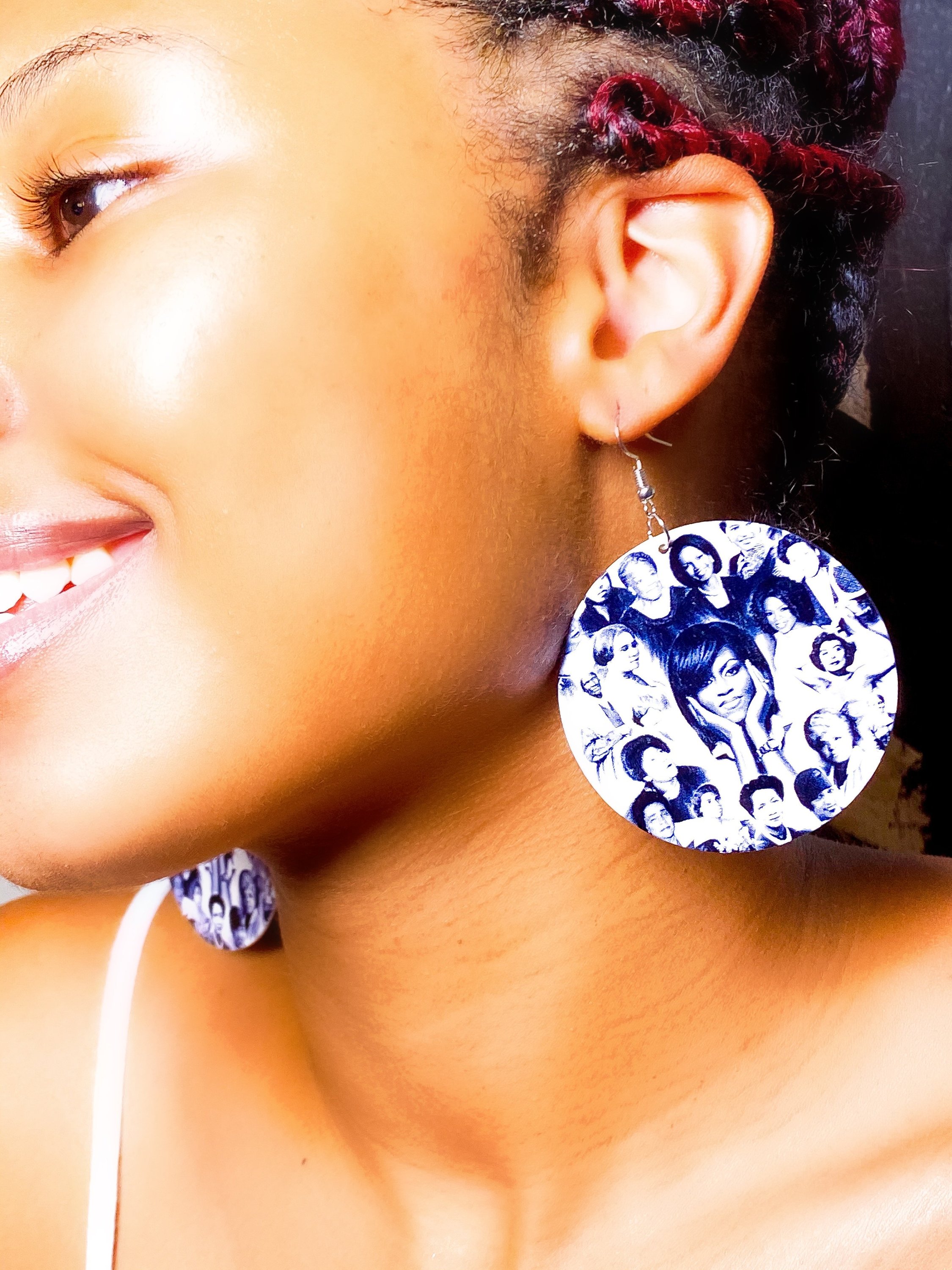 Hoops - Her Legacy earrings featuring a round wooden design with brass ear hooks, available in black and white colors.