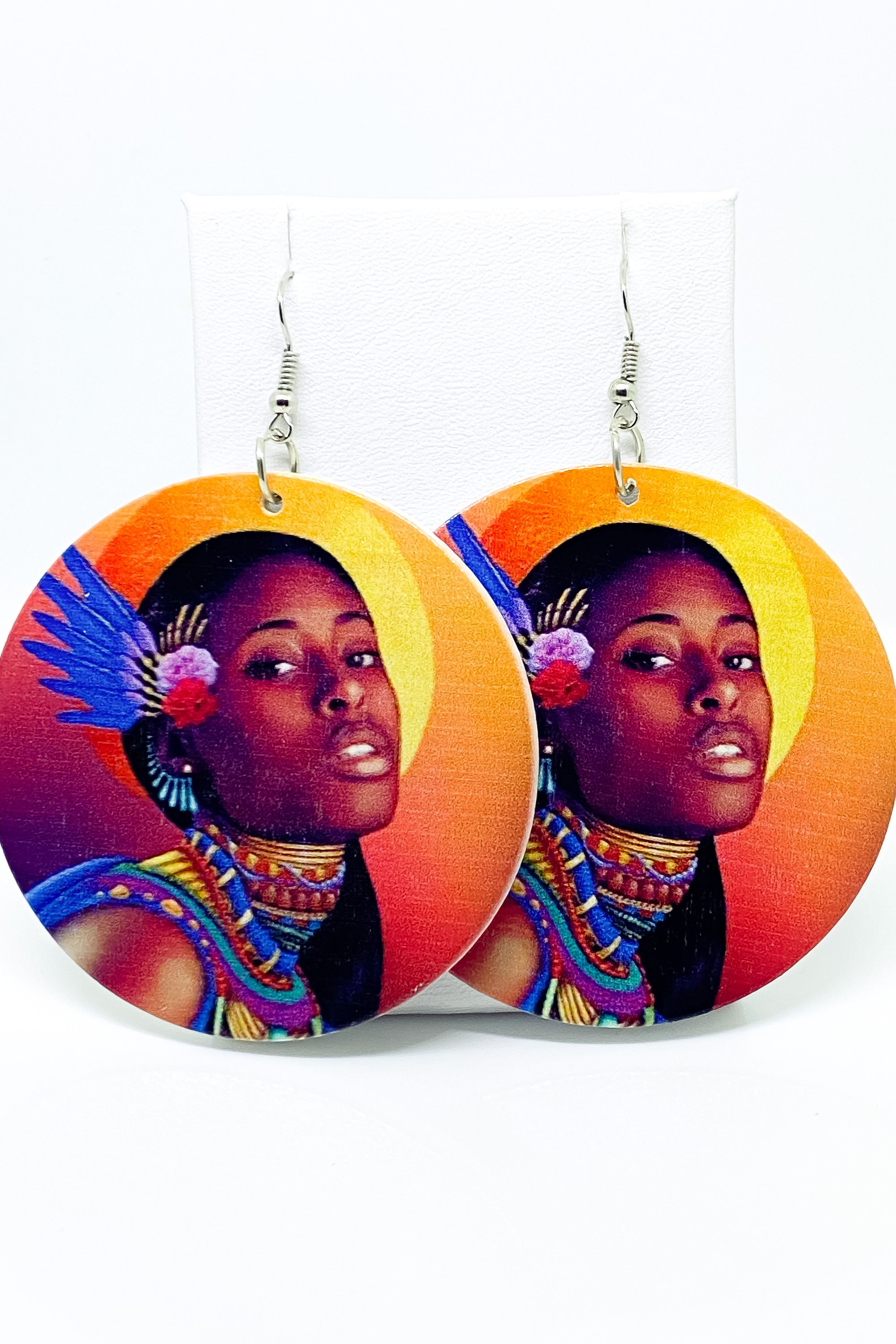 Hoops - Indigenous Bae earrings featuring vibrant orange, blue, and brown colors, handcrafted from wood with brass ear hooks.