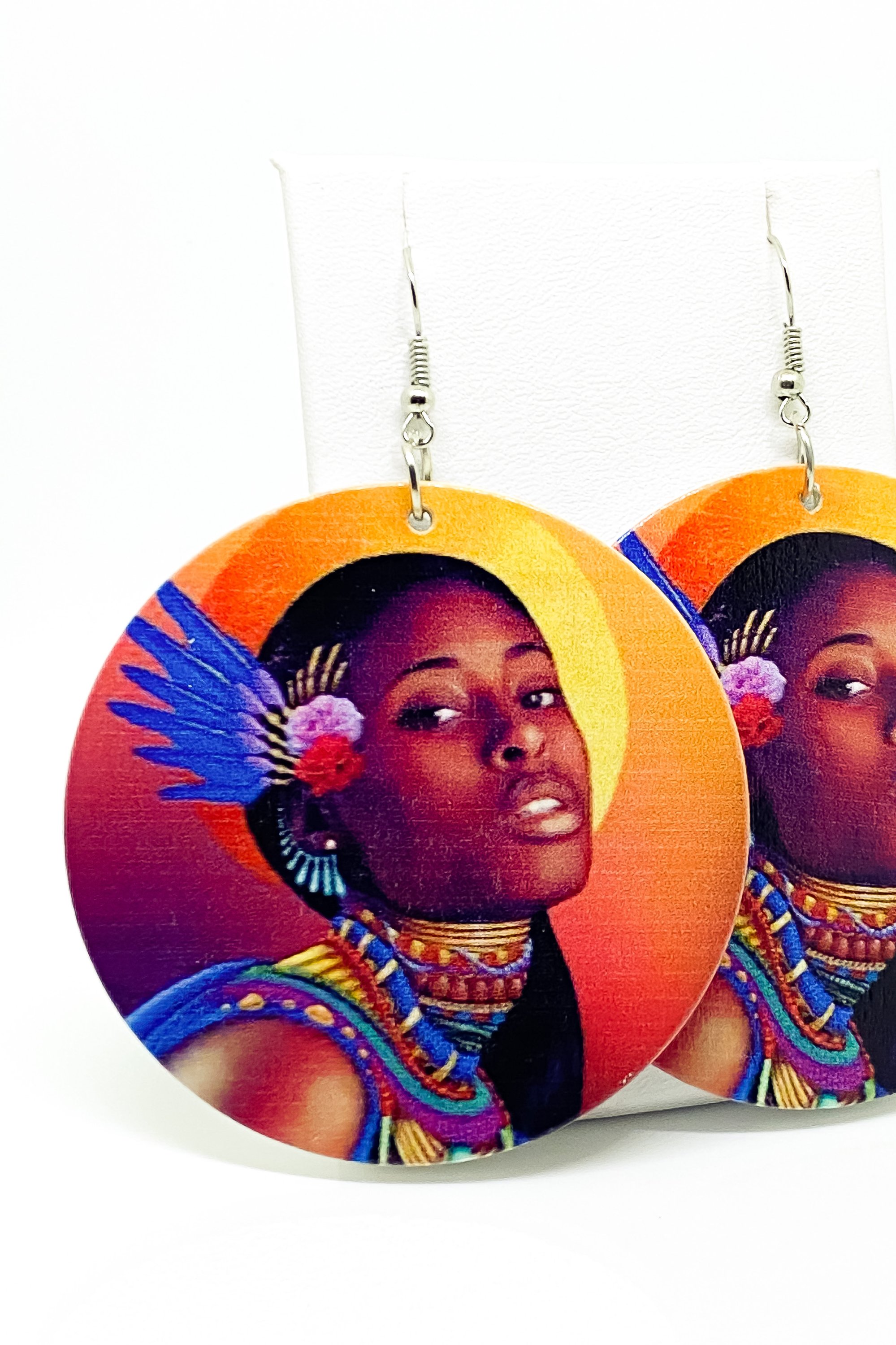 Hoops - Indigenous Bae earrings featuring vibrant orange, blue, and brown colors, handcrafted from wood with brass ear hooks.