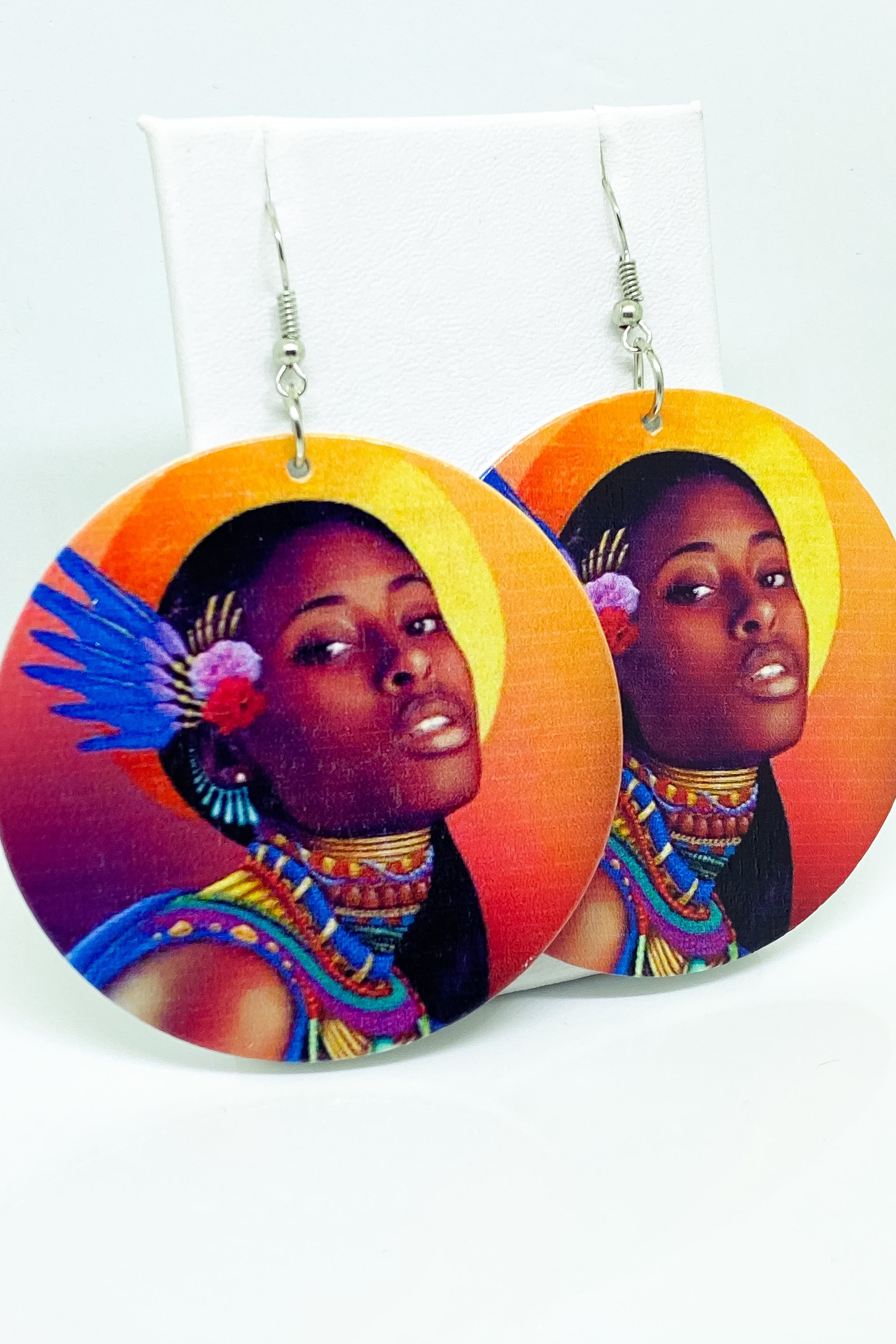 Hoops - Indigenous Bae earrings featuring vibrant orange, blue, and brown colors, handcrafted from wood with brass ear hooks.