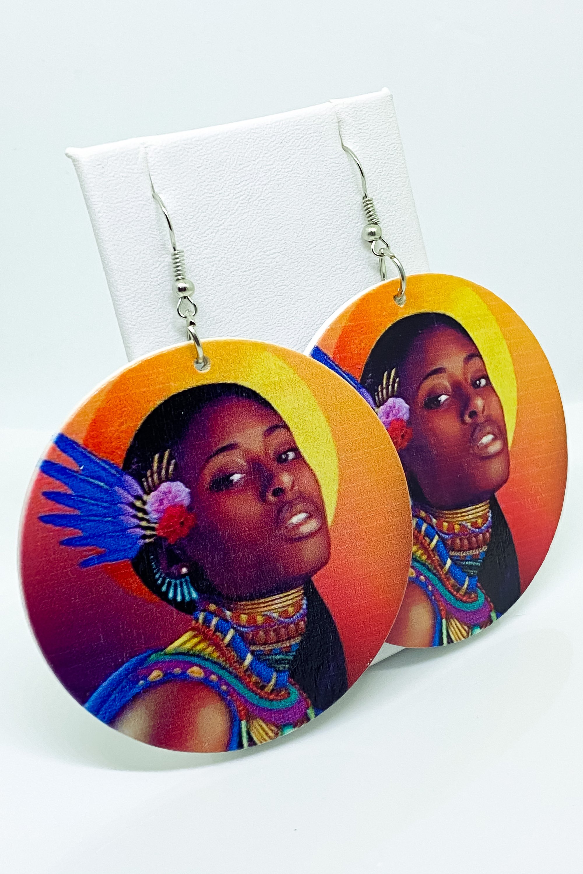 Hoops - Indigenous Bae earrings featuring vibrant orange, blue, and brown colors, handcrafted from wood with brass ear hooks.