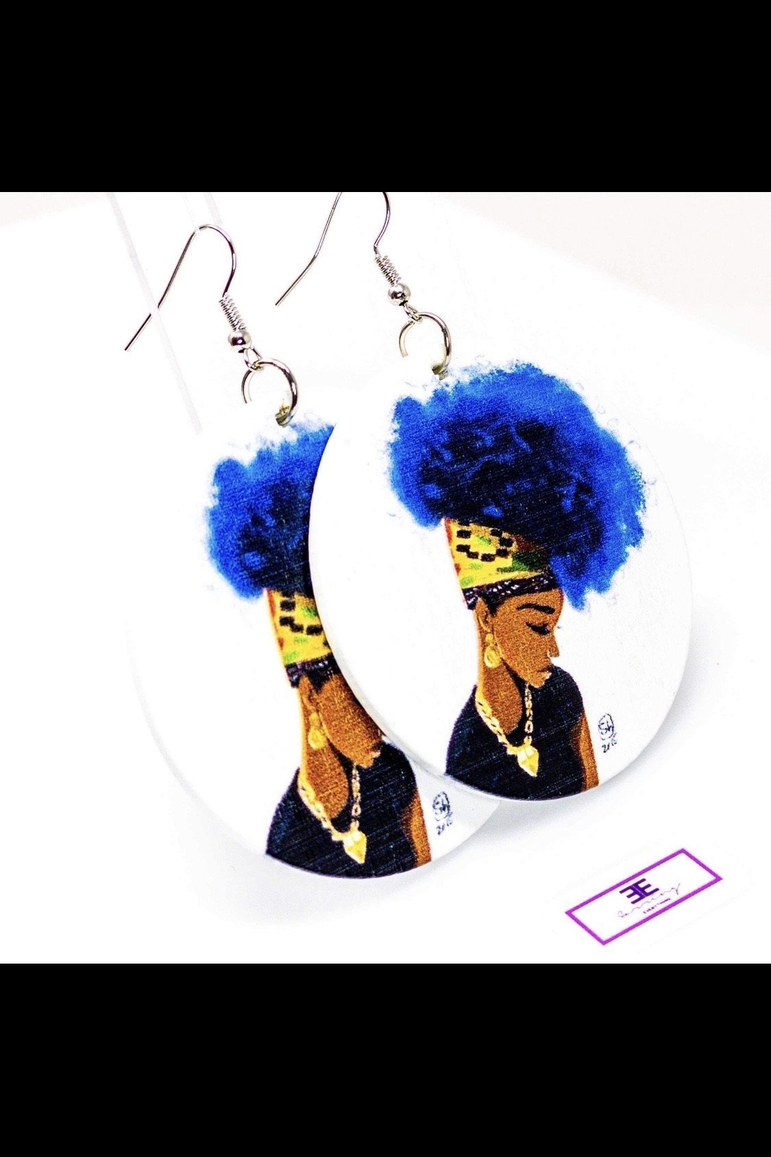 Kenisha's Up-Do hoop earrings made of wood, featuring a round shape and brass ear hooks, available in blue and brown colors.