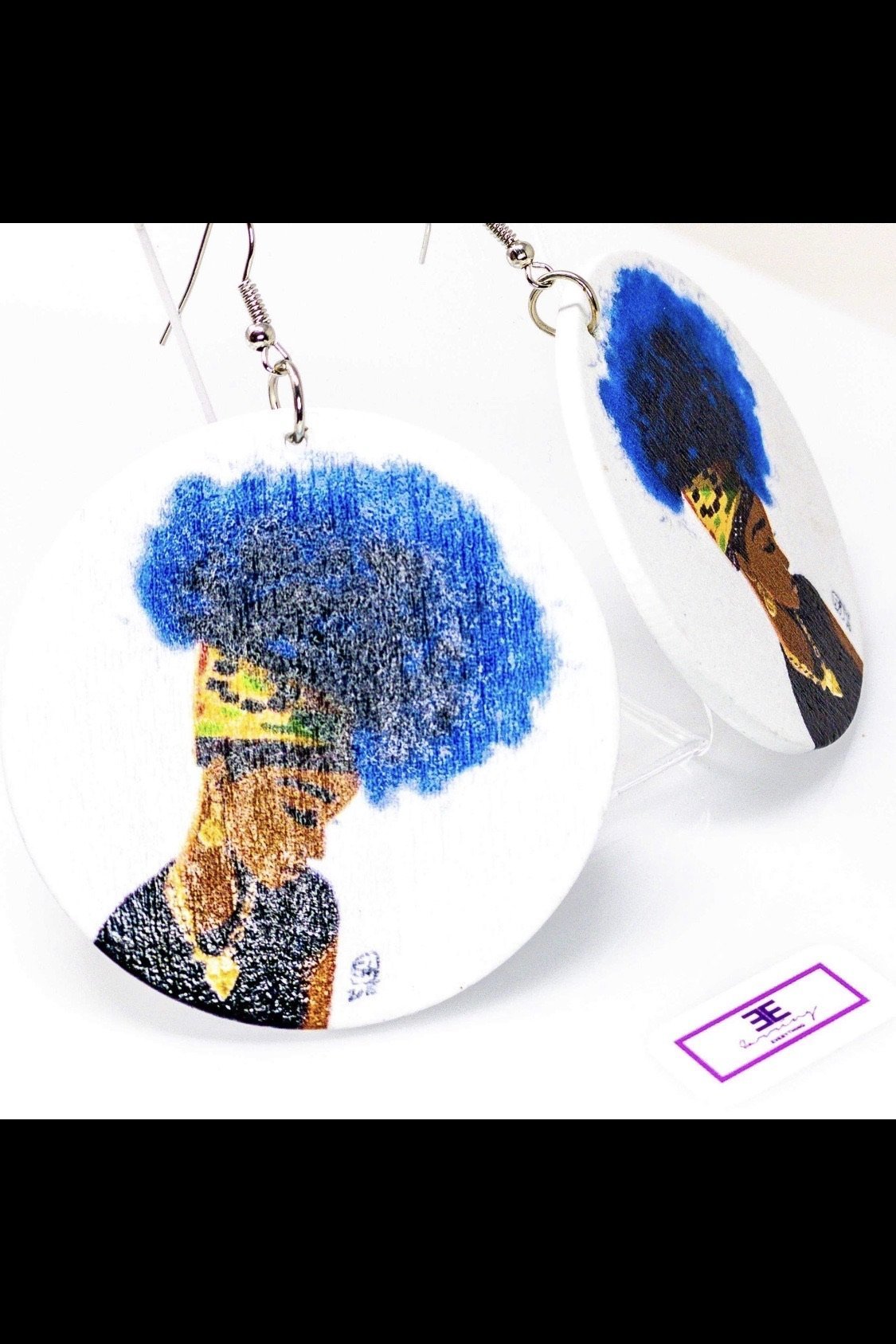 Kenisha's Up-Do hoop earrings made of wood, featuring a round shape and brass ear hooks, available in blue and brown colors.