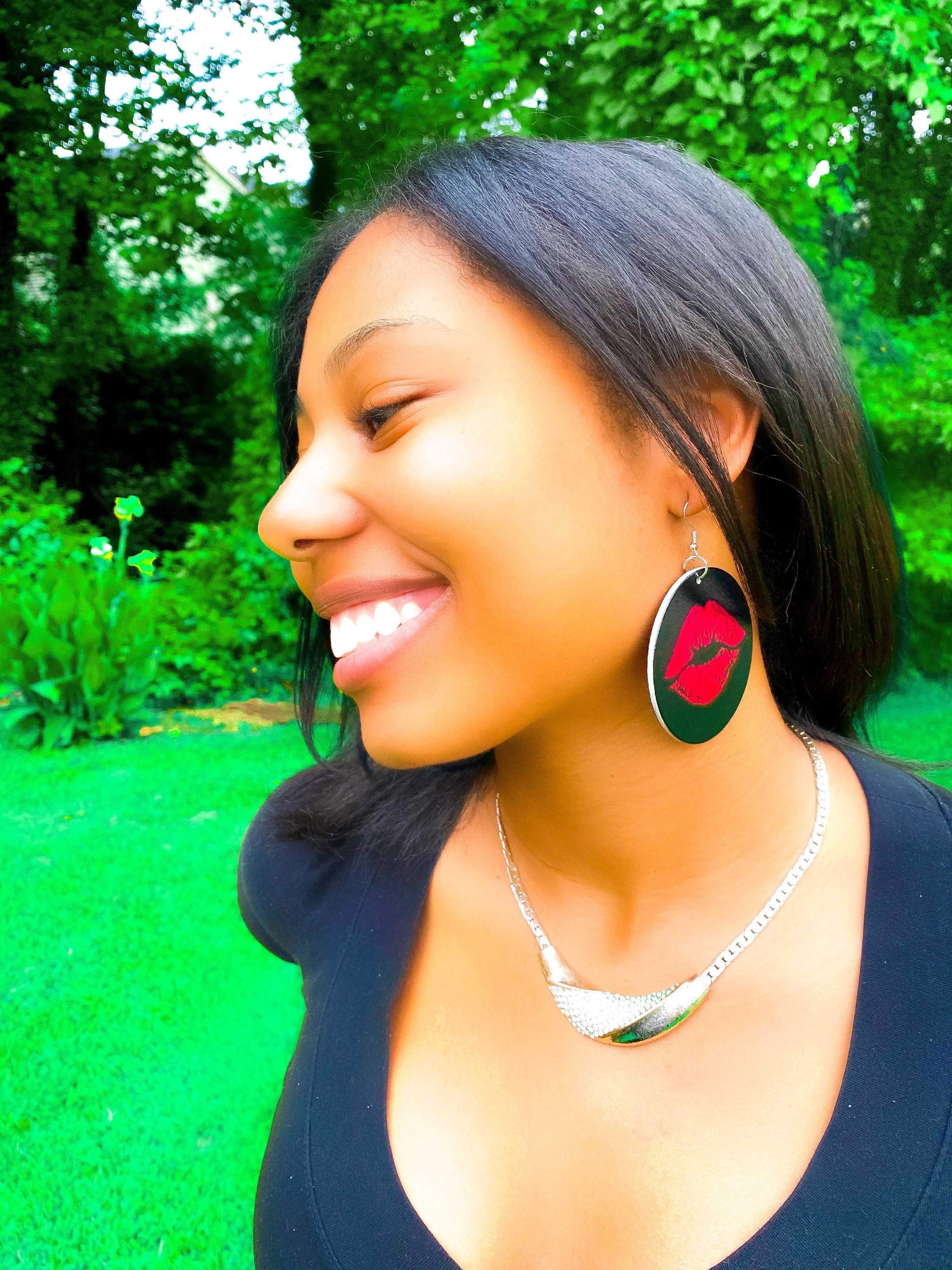 Hoops - Kiss Me earrings featuring a unique print design, made from wood with brass ear hooks, available in black and red colors.