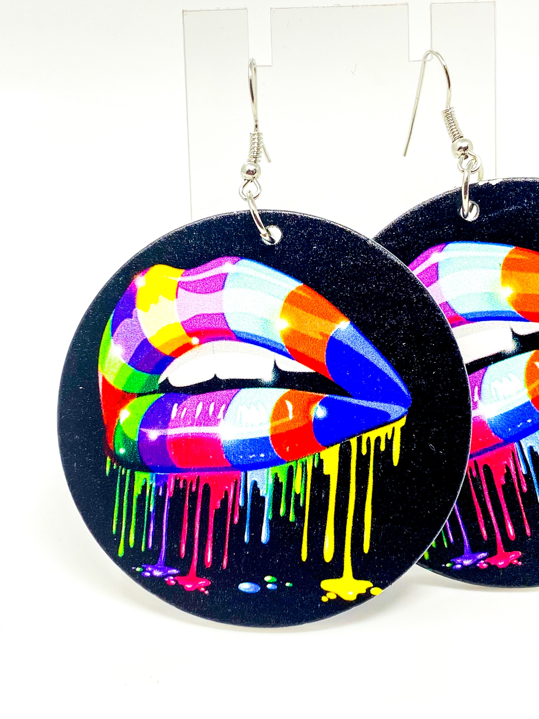 Colorful handmade wooden hoop earrings with a vibrant rainbow print, featuring nickel-free brass ear hooks.