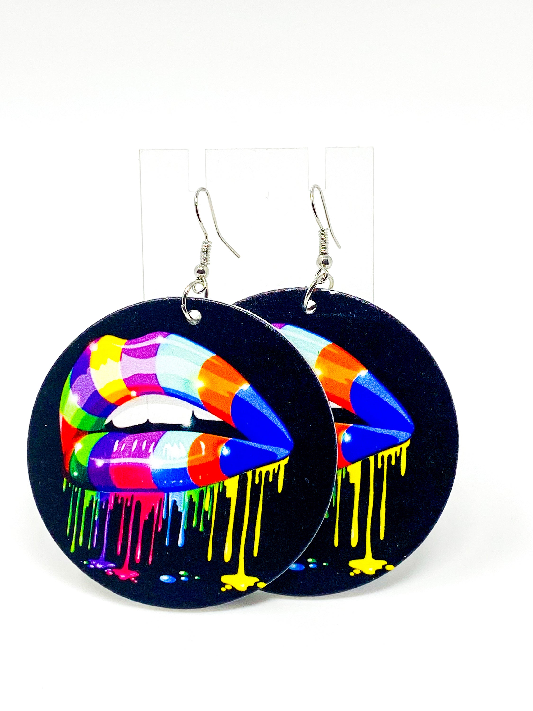 Colorful handmade wooden hoop earrings with a vibrant rainbow print, featuring nickel-free brass ear hooks.