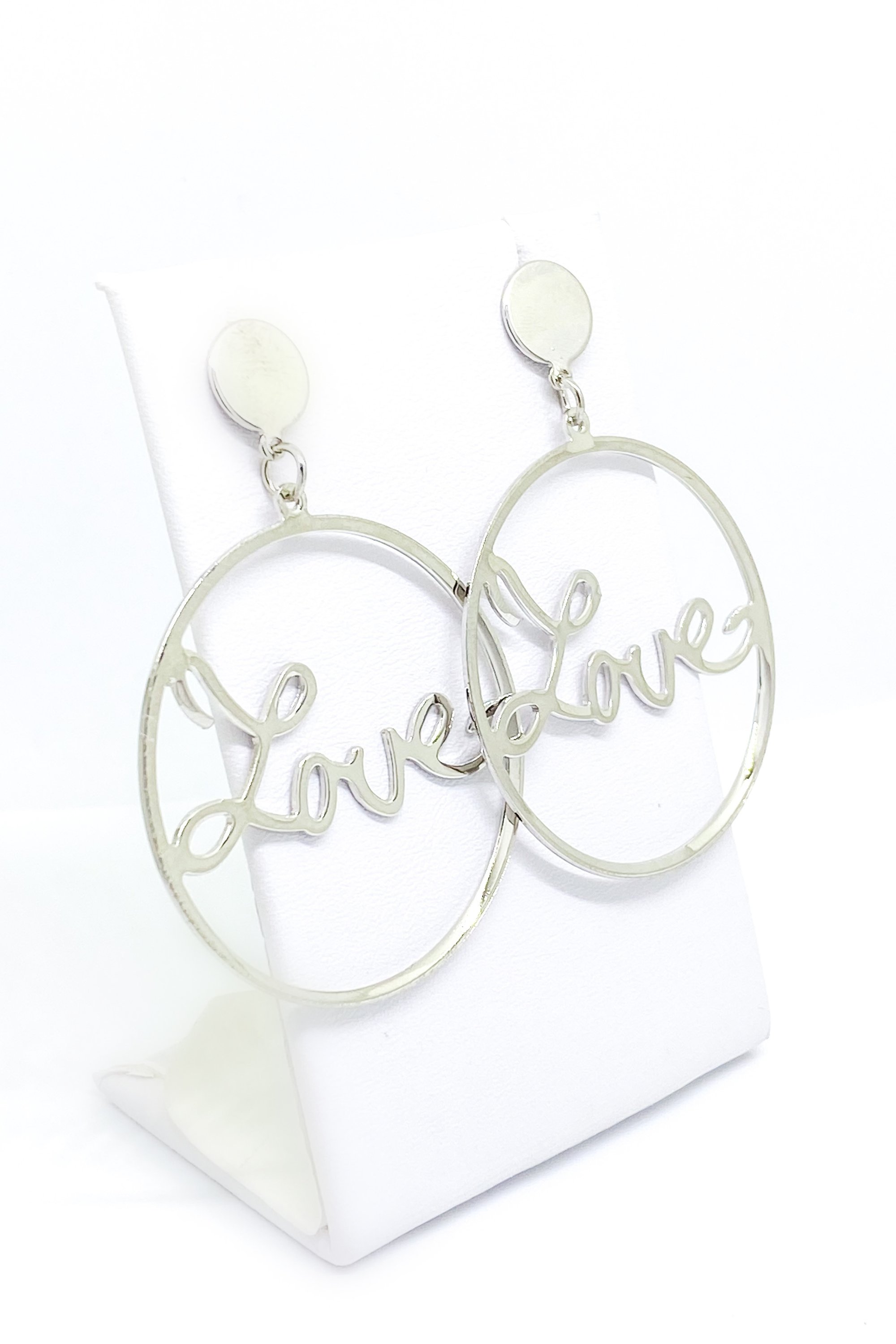 A pair of elegant dangle hoop earrings in silver and gold, showcasing a geometric round design made from high-quality zinc alloy.