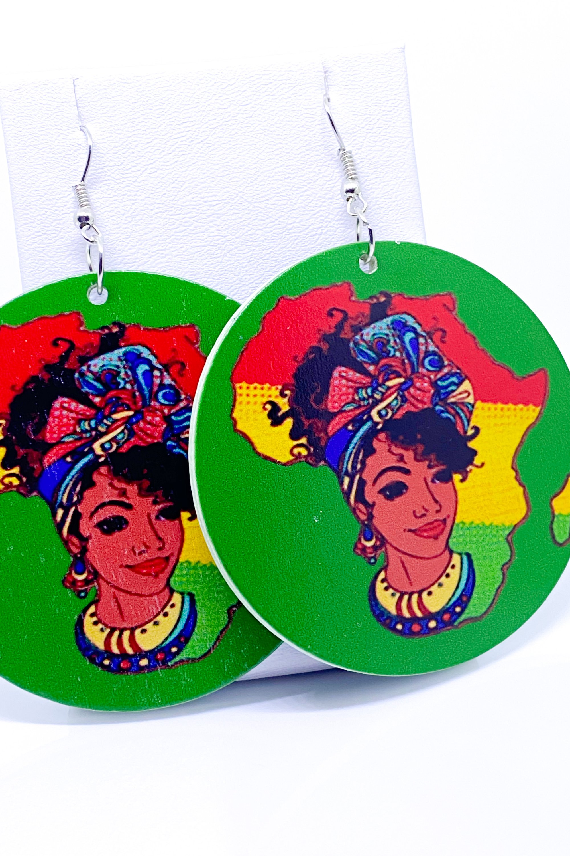 Colorful handmade wooden hoop earrings in green, red, and yellow, showcasing a vibrant cultural design.