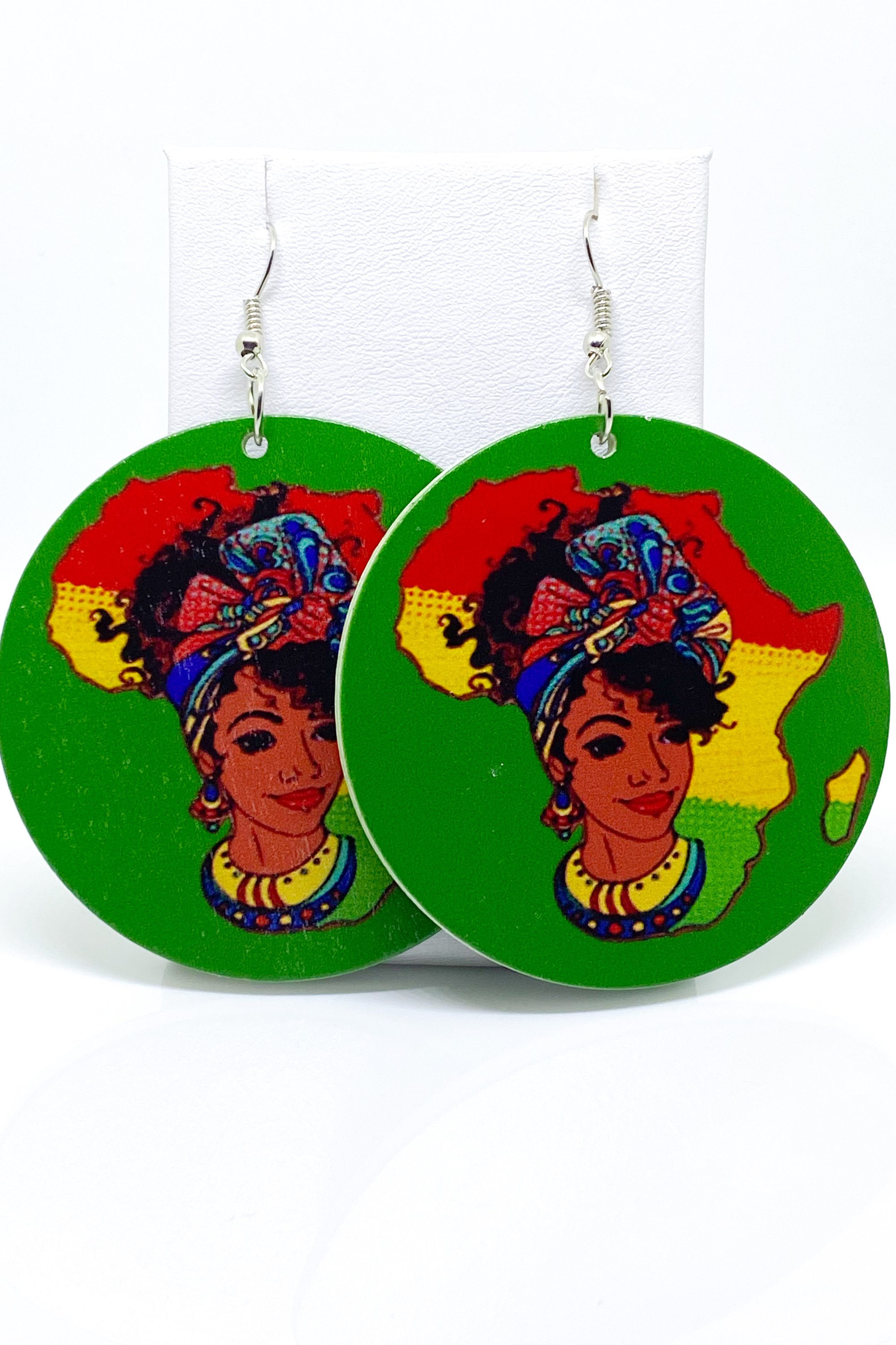 Colorful handmade wooden hoop earrings in green, red, and yellow, showcasing a vibrant cultural design.