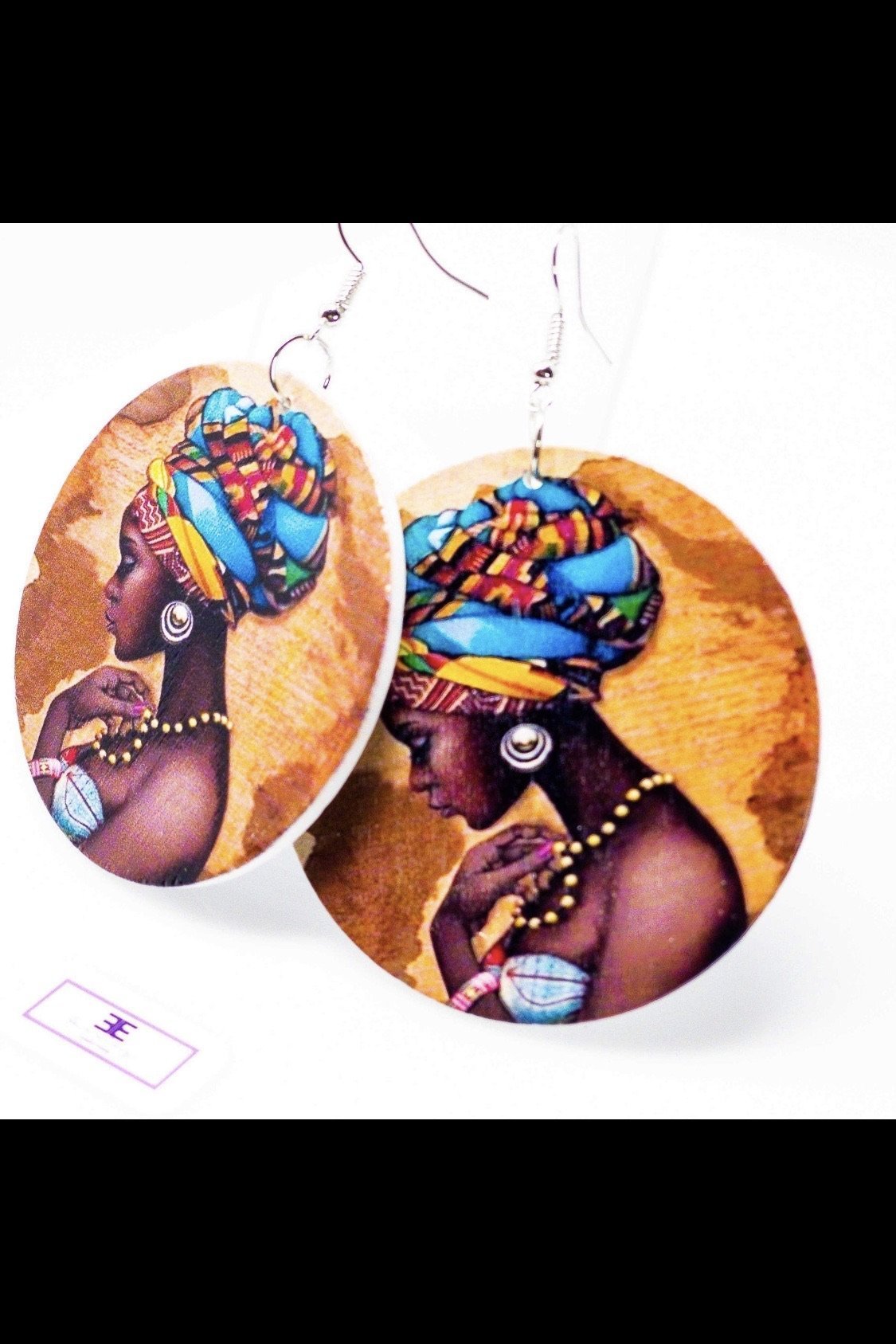 Handmade wooden hoop drop earrings in blue and brown, featuring nickel-free brass ear hooks, showcasing a cultural and casual style.