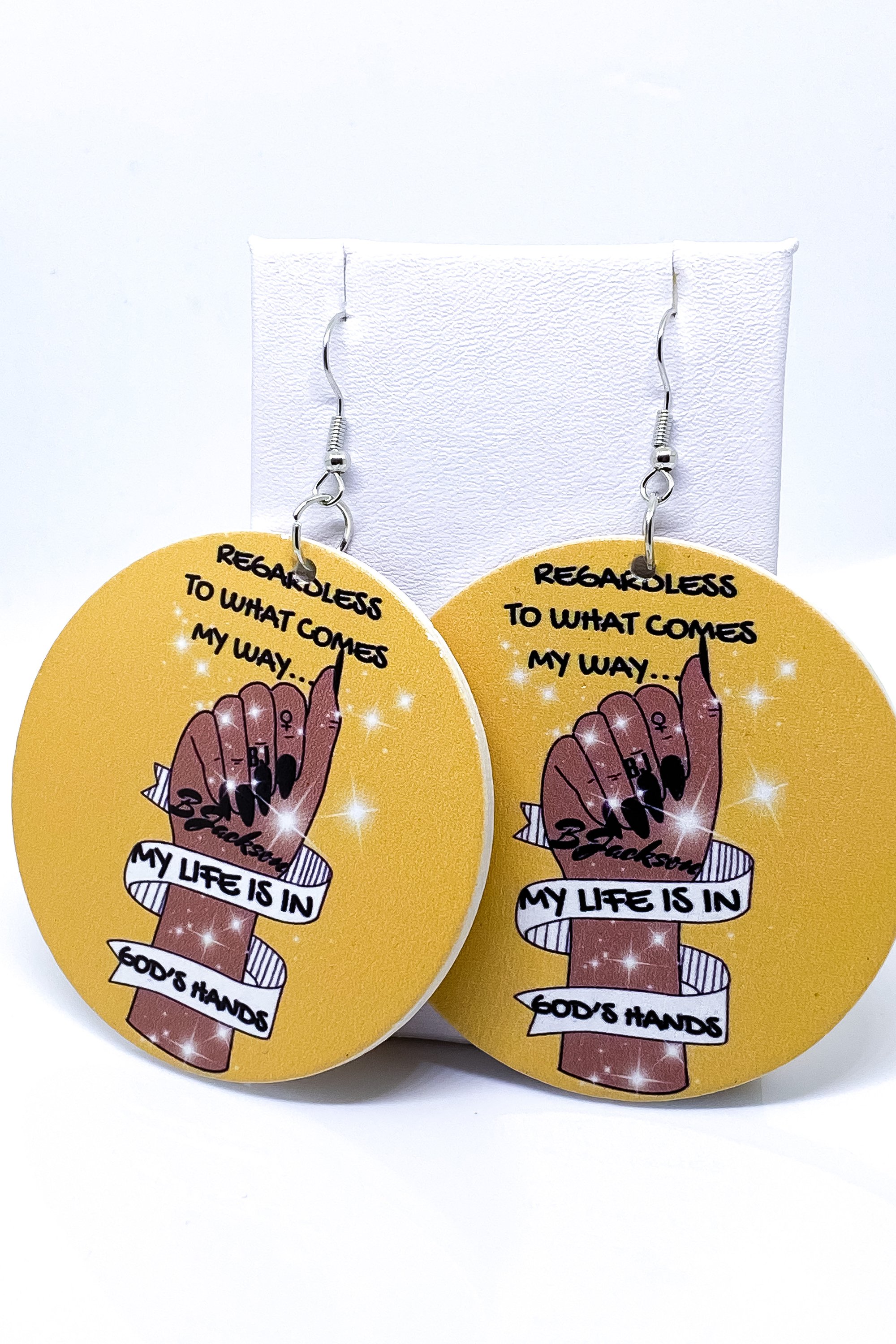 Stylish handmade wooden hoop earrings with black finish and brass ear hooks, featuring a unique back print design.