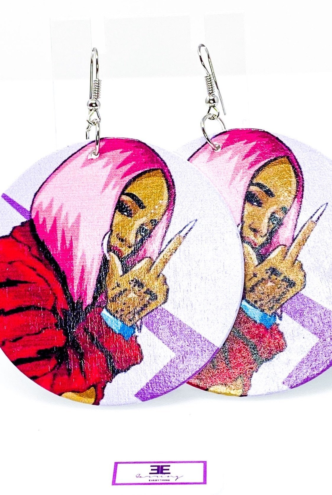 Handmade wooden hoop earrings in pink, purple, and fuchsia colors, featuring nickel-free brass ear hooks.