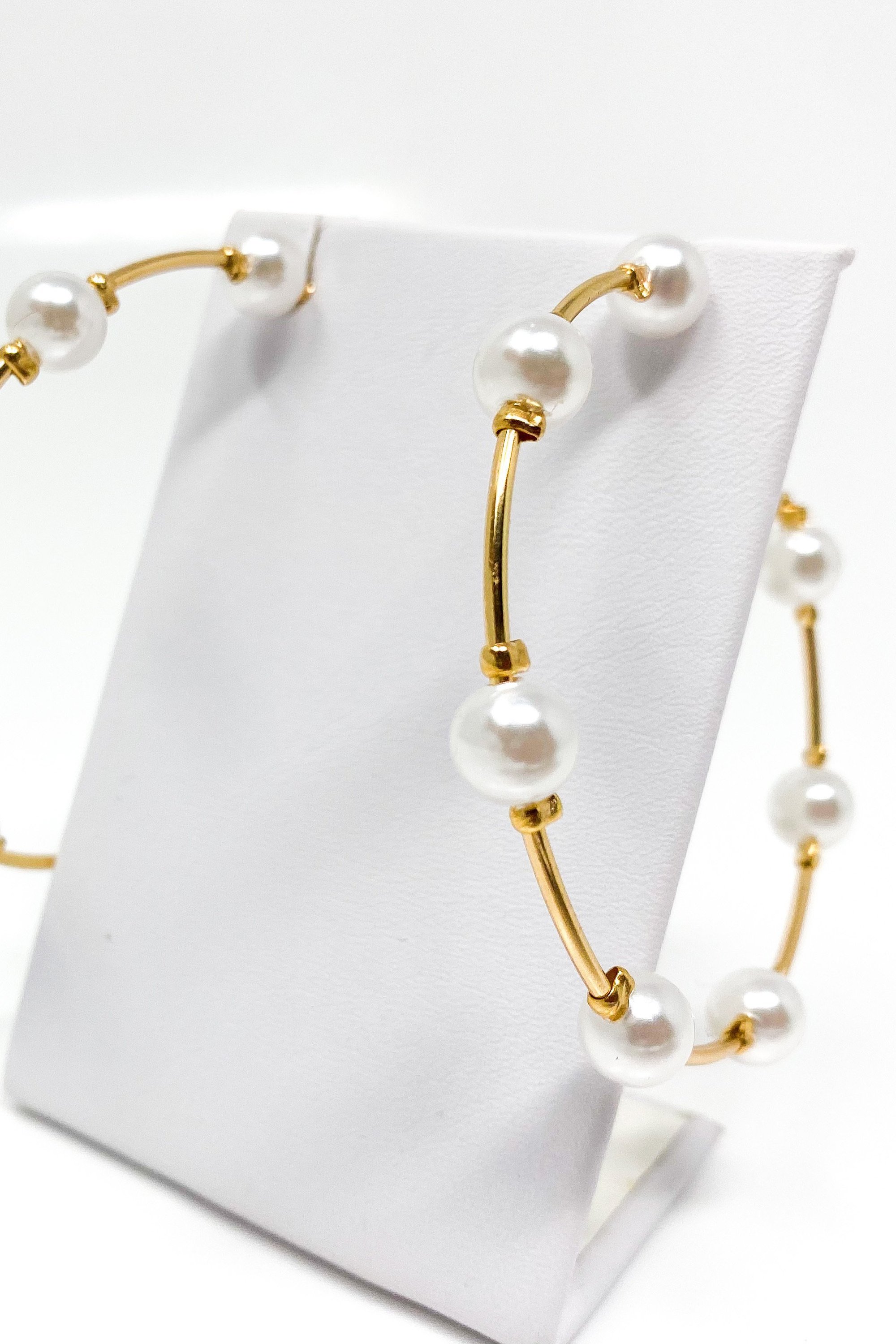 Elegant Upper Echelon Pearl & Gold Hoop Earrings made from high-quality zinc alloy, featuring a luxurious design suitable for any occasion.