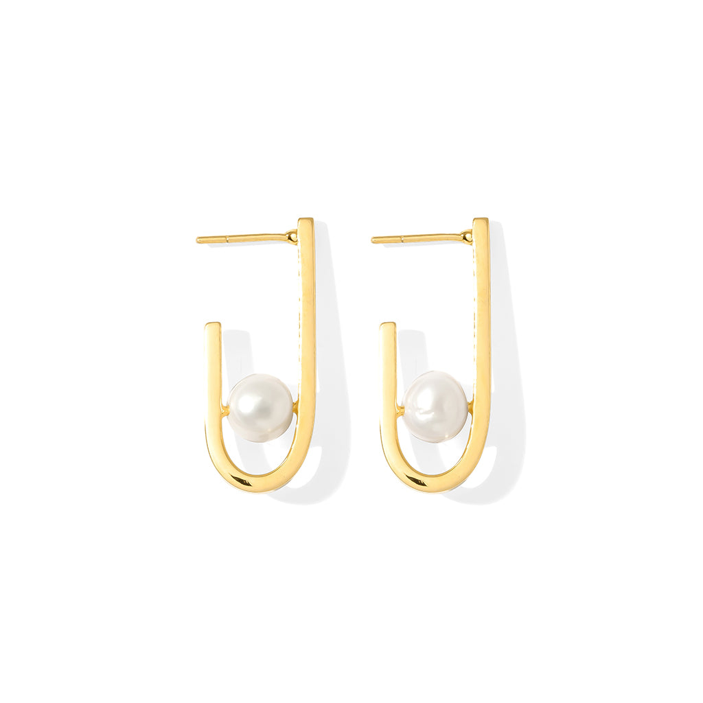 A pair of J Hoop Freshwater Pearl Earrings featuring recycled brass and elegant pearls, showcasing sustainable craftsmanship.