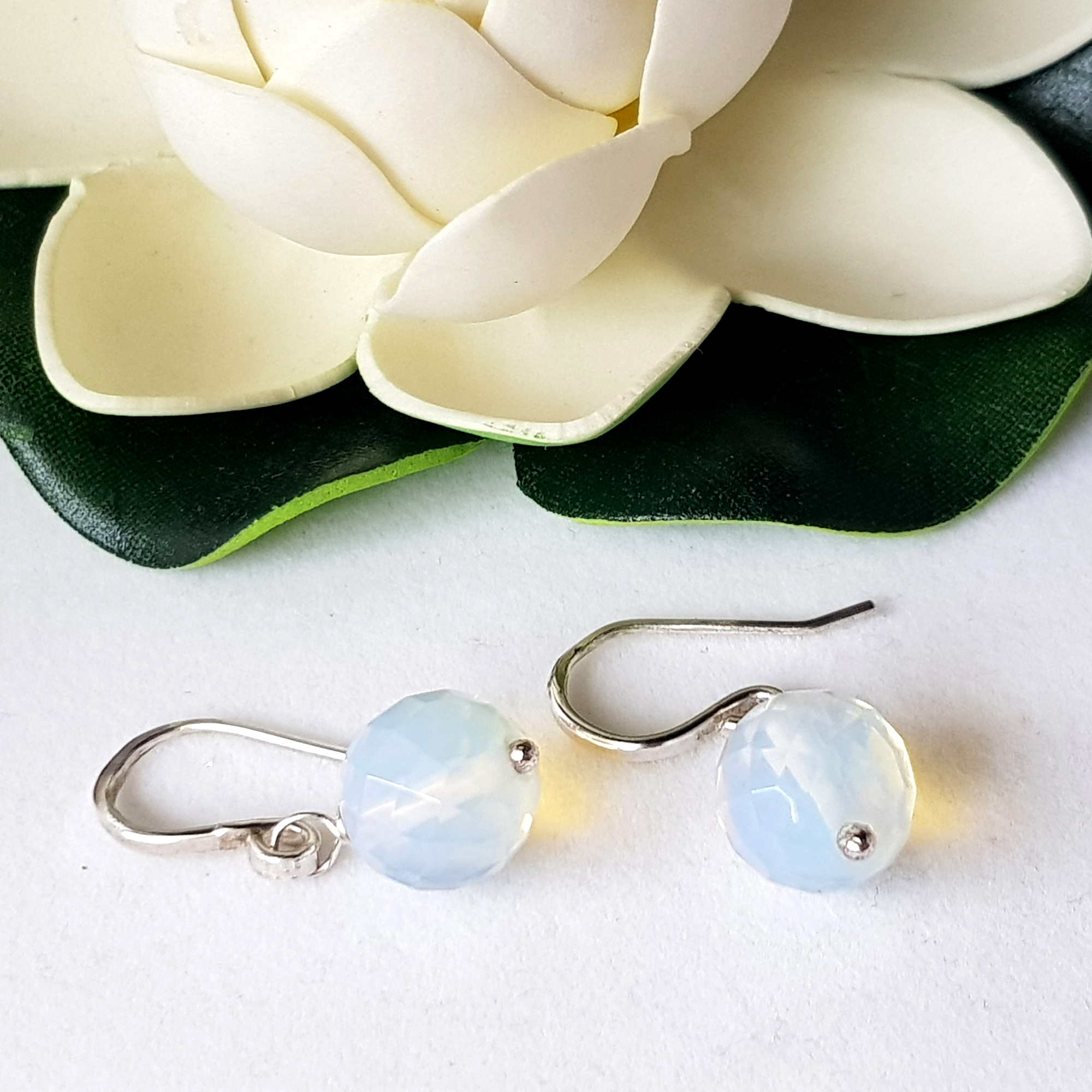 A pair of elegant Jelly Opal Dangle Earrings featuring 11mm faceted opals in solid sterling silver, showcasing vibrant colors.