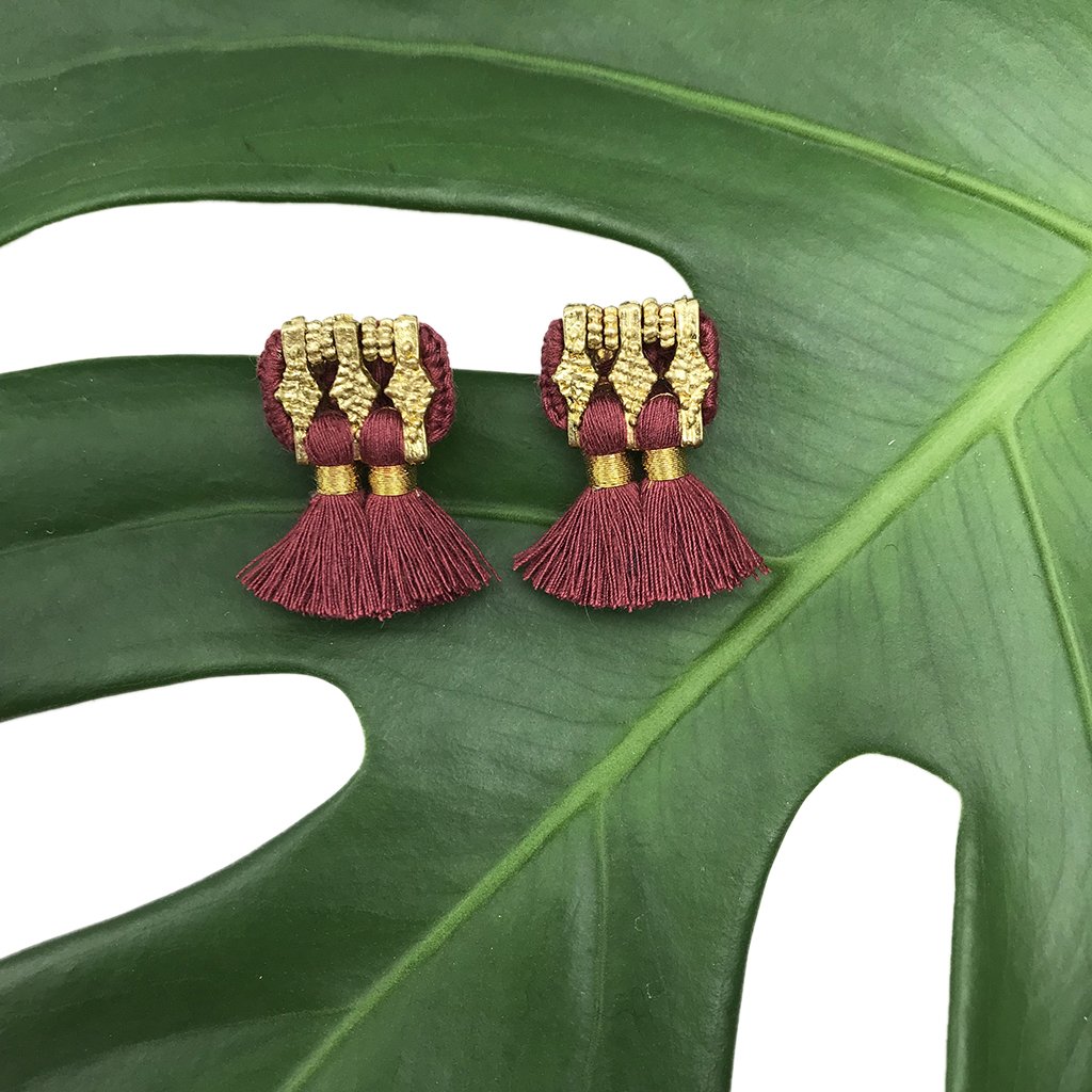 A pair of colorful Jhumka Earrings featuring tassels, handcrafted in India from zinc alloy and cotton, showcasing traditional Indian design.