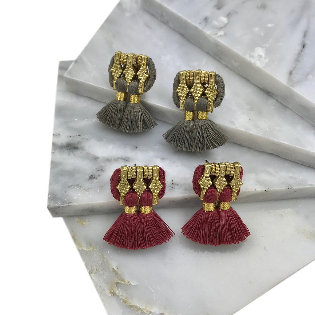 A pair of colorful Jhumka Earrings featuring tassels, handcrafted in India from zinc alloy and cotton, showcasing traditional Indian design.