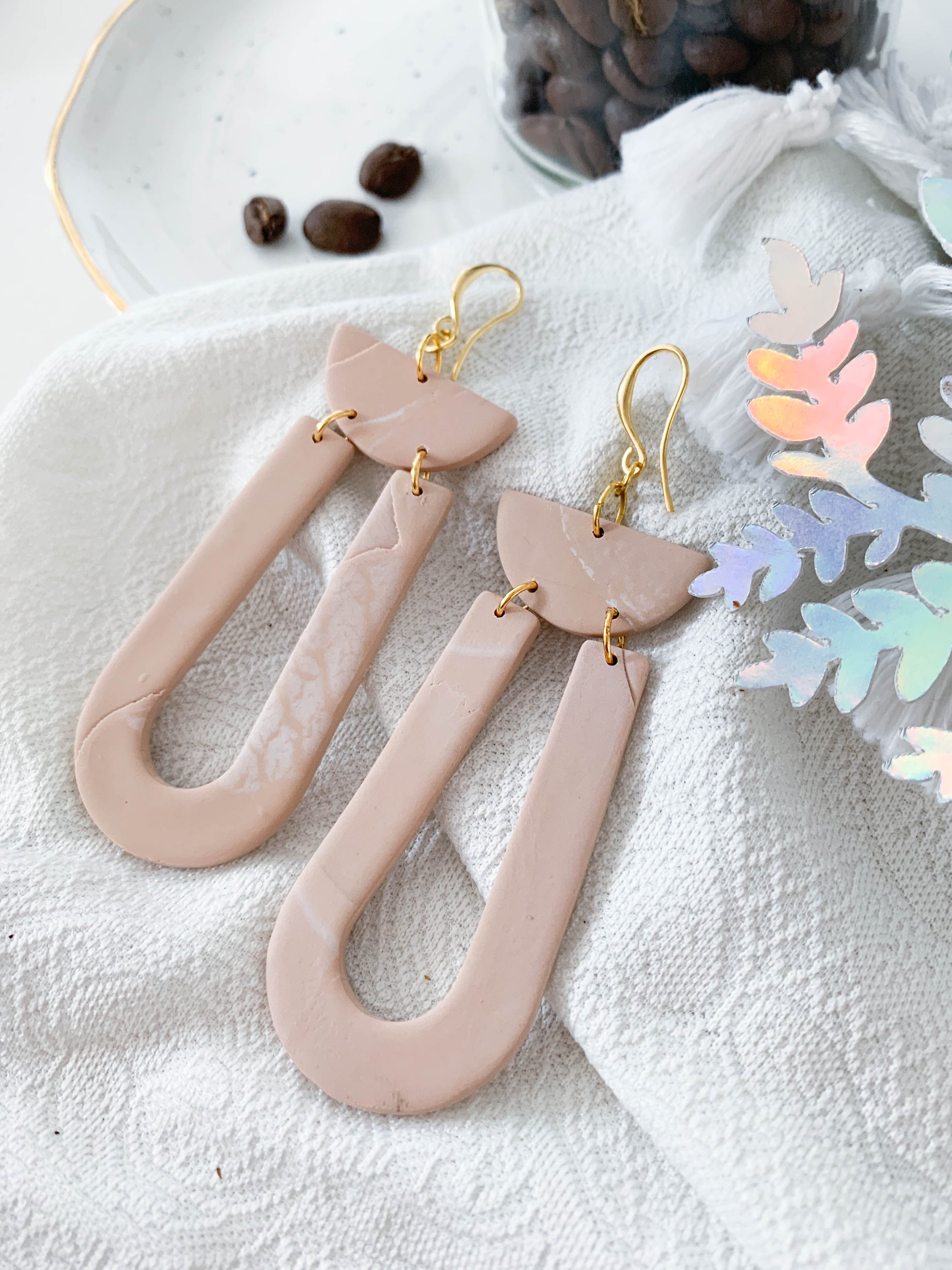 Handmade Josie Latte earrings featuring unique marbling and 24k gold plated brass hooks, elegantly designed for stylish wear.