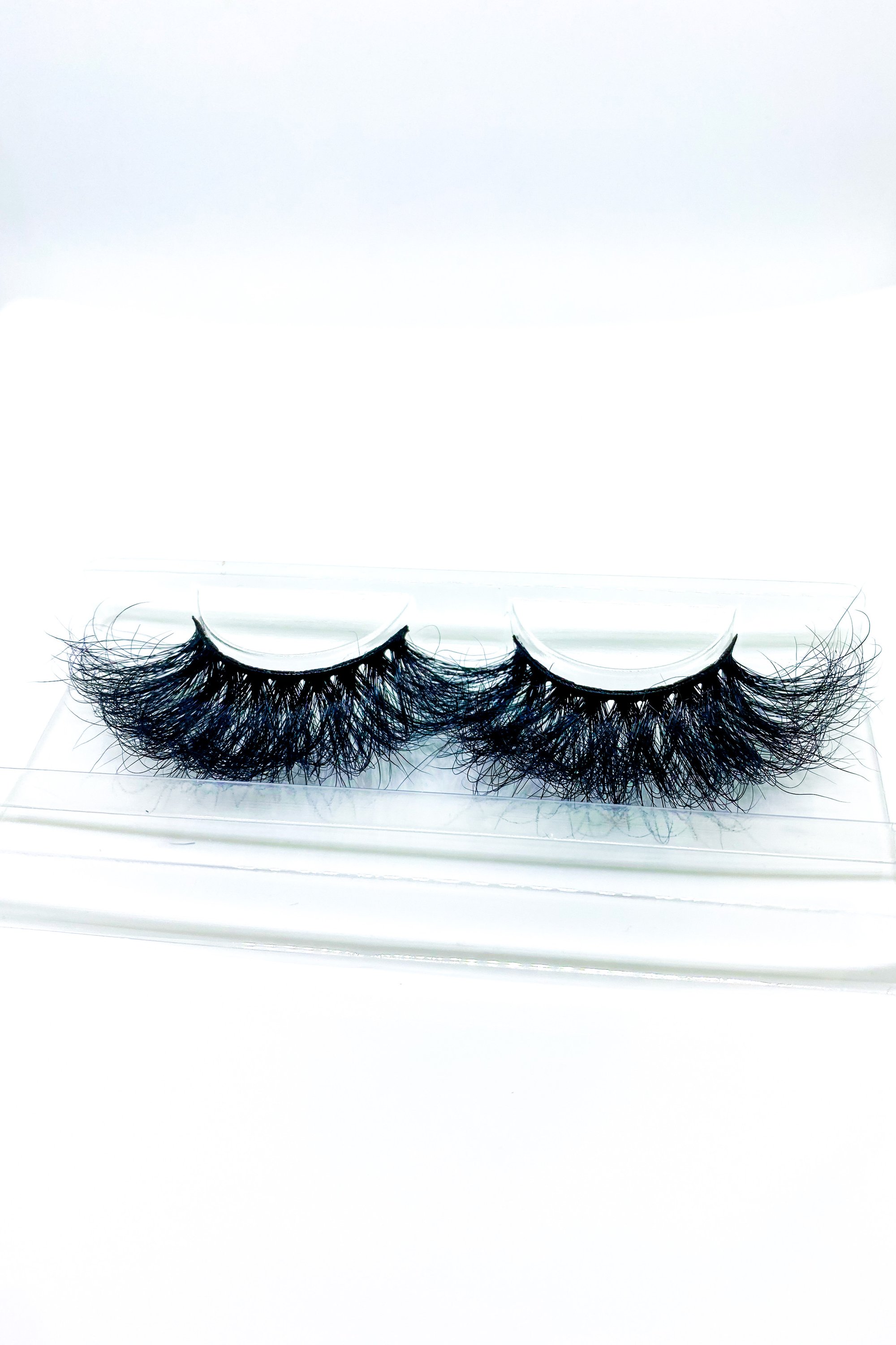 Lash Bae Boom Kack Pow 25mm Mink Strip Lashes, showcasing their voluminous and handmade quality.