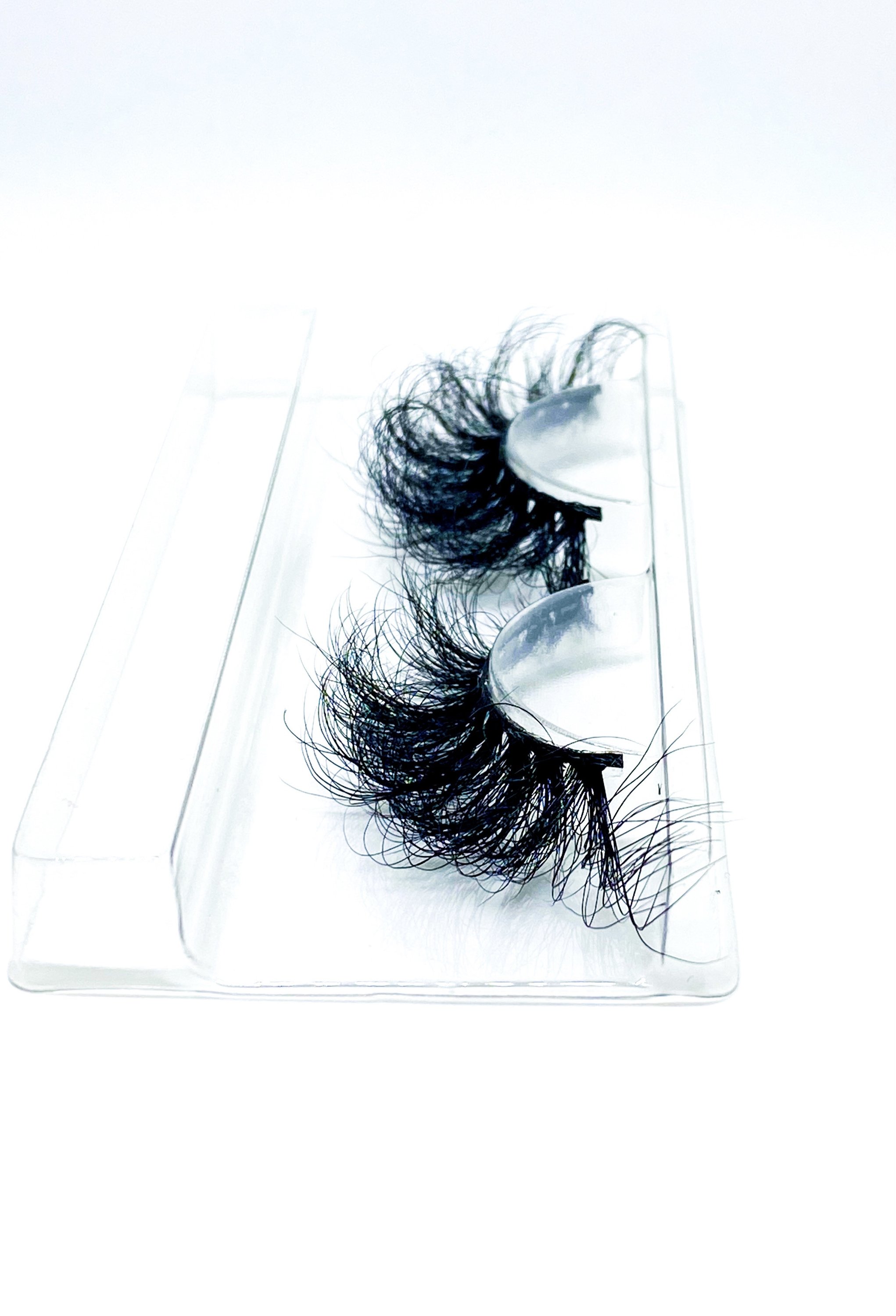 Lash Bae Moola Baby 25mm 3D Mink Full Volume Strip Lashes displayed elegantly, showcasing their luxurious design and quality.