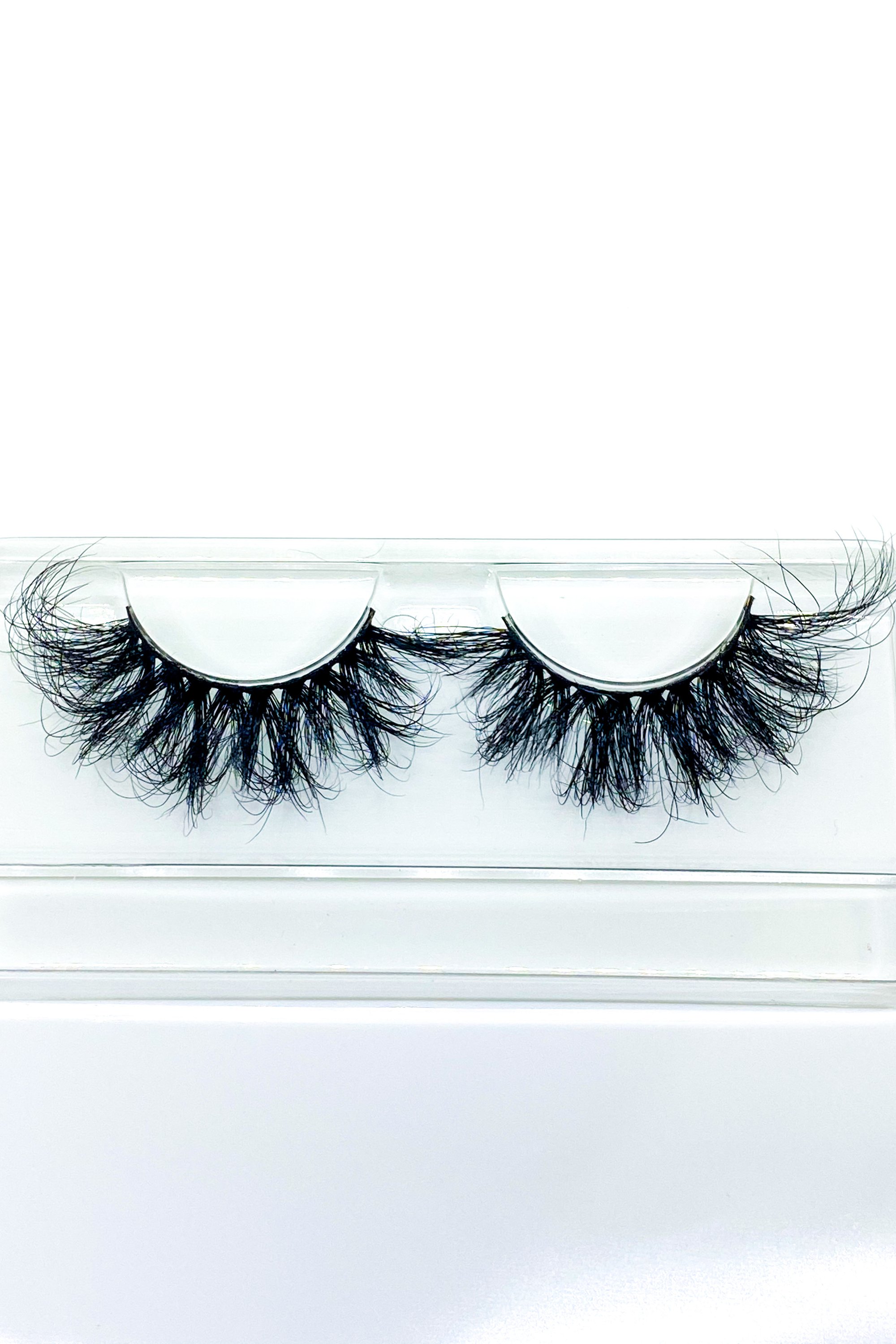 Lash Bae Moola Baby 25mm 3D Mink Full Volume Strip Lashes displayed elegantly, showcasing their luxurious design and quality.