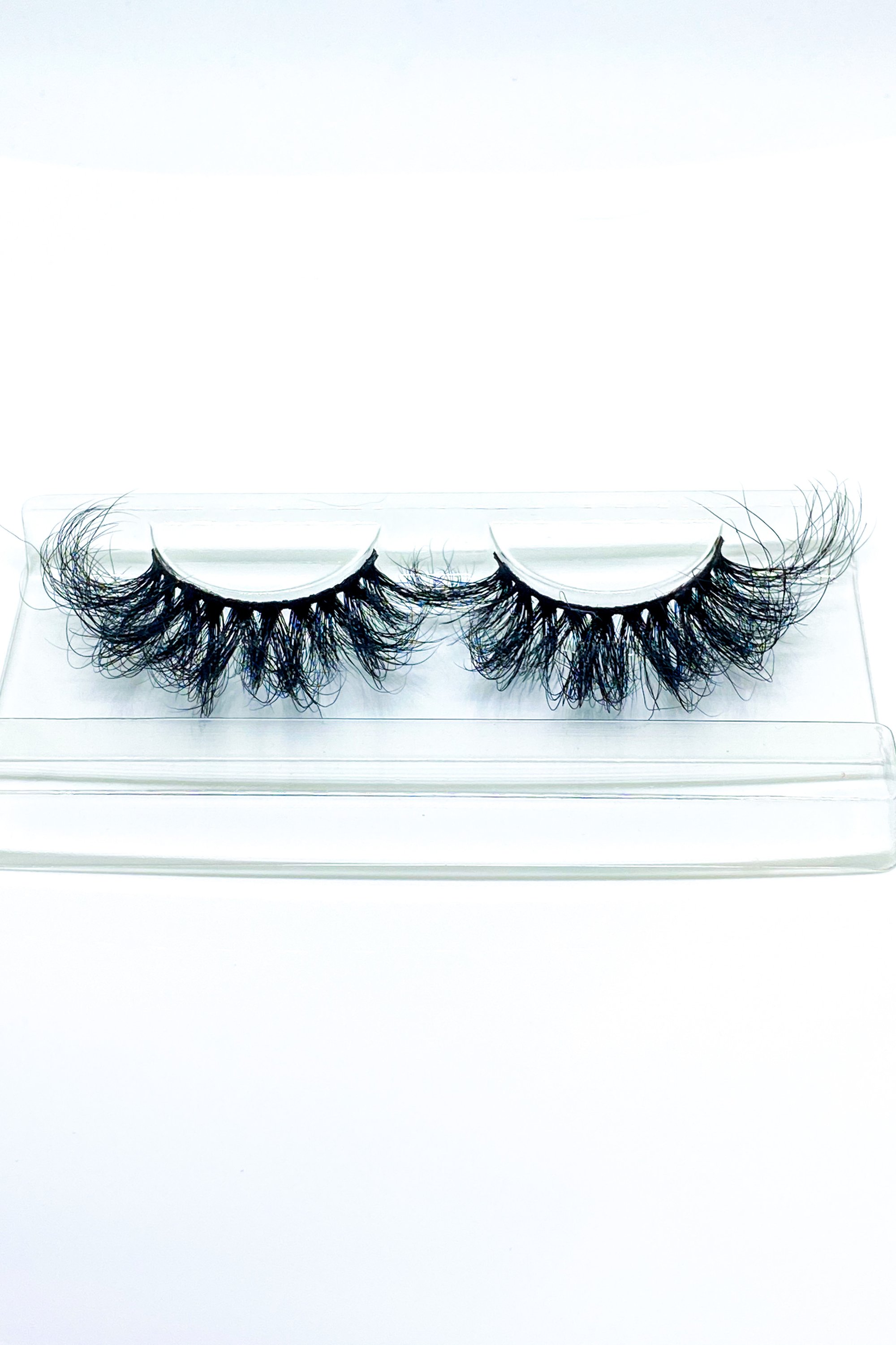 Lash Bae Moola Baby 25mm 3D Mink Full Volume Strip Lashes displayed elegantly, showcasing their luxurious design and quality.