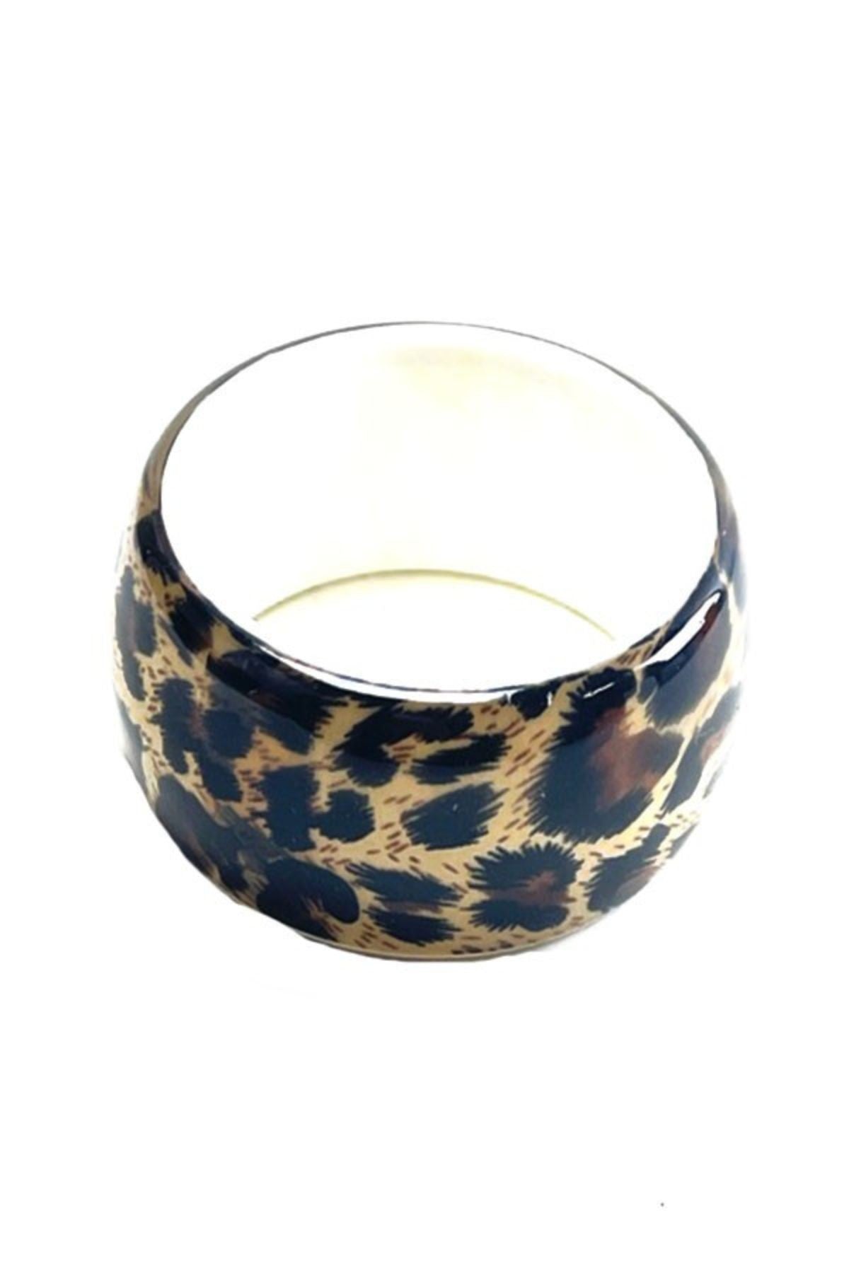 Leopard print bangle bracelet with a stylish design, perfect for accessorizing any outfit.