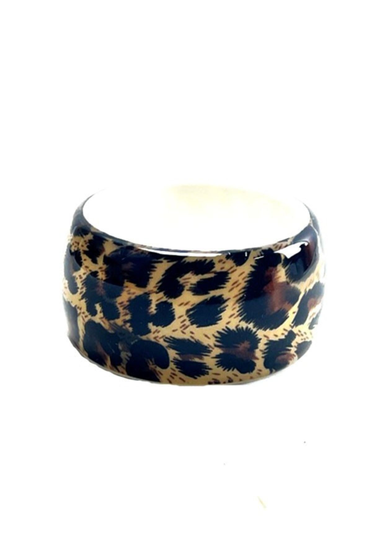 Leopard print bangle bracelet with a stylish design, perfect for accessorizing any outfit.