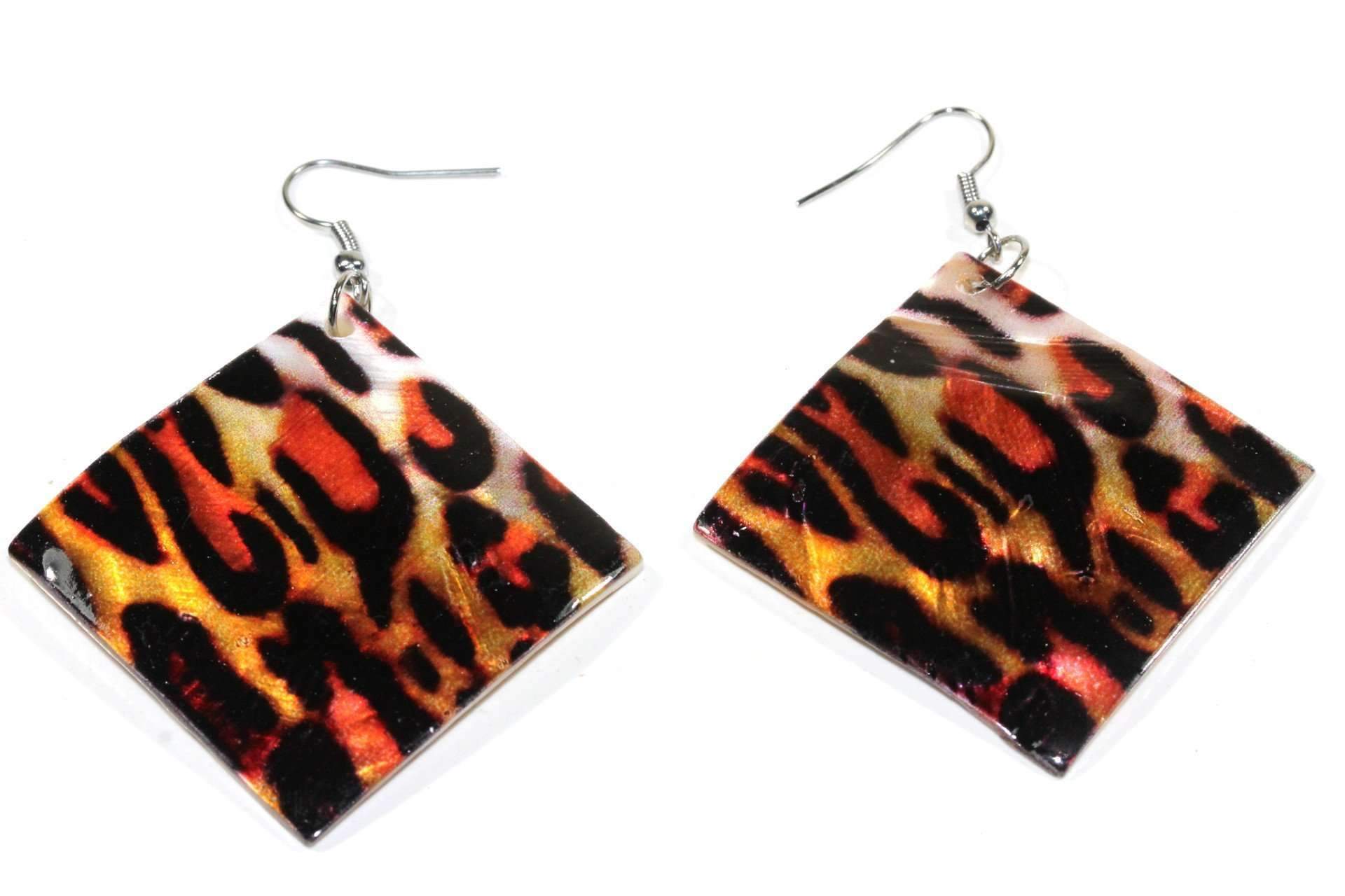 A pair of handcrafted leopard print earrings made from natural mother of pearl, showcasing a beautiful luster and unique design.