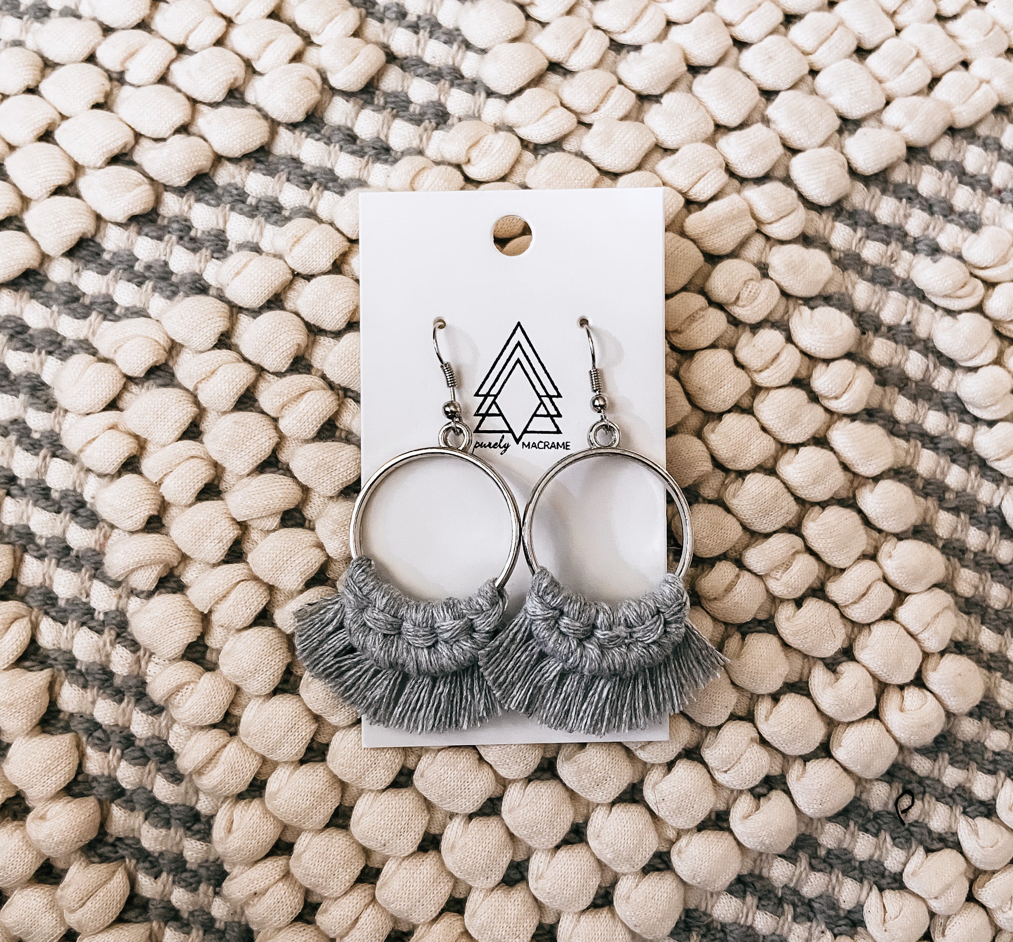 Light gray round earrings made from macrame cotton, lightweight and stylish for any occasion.