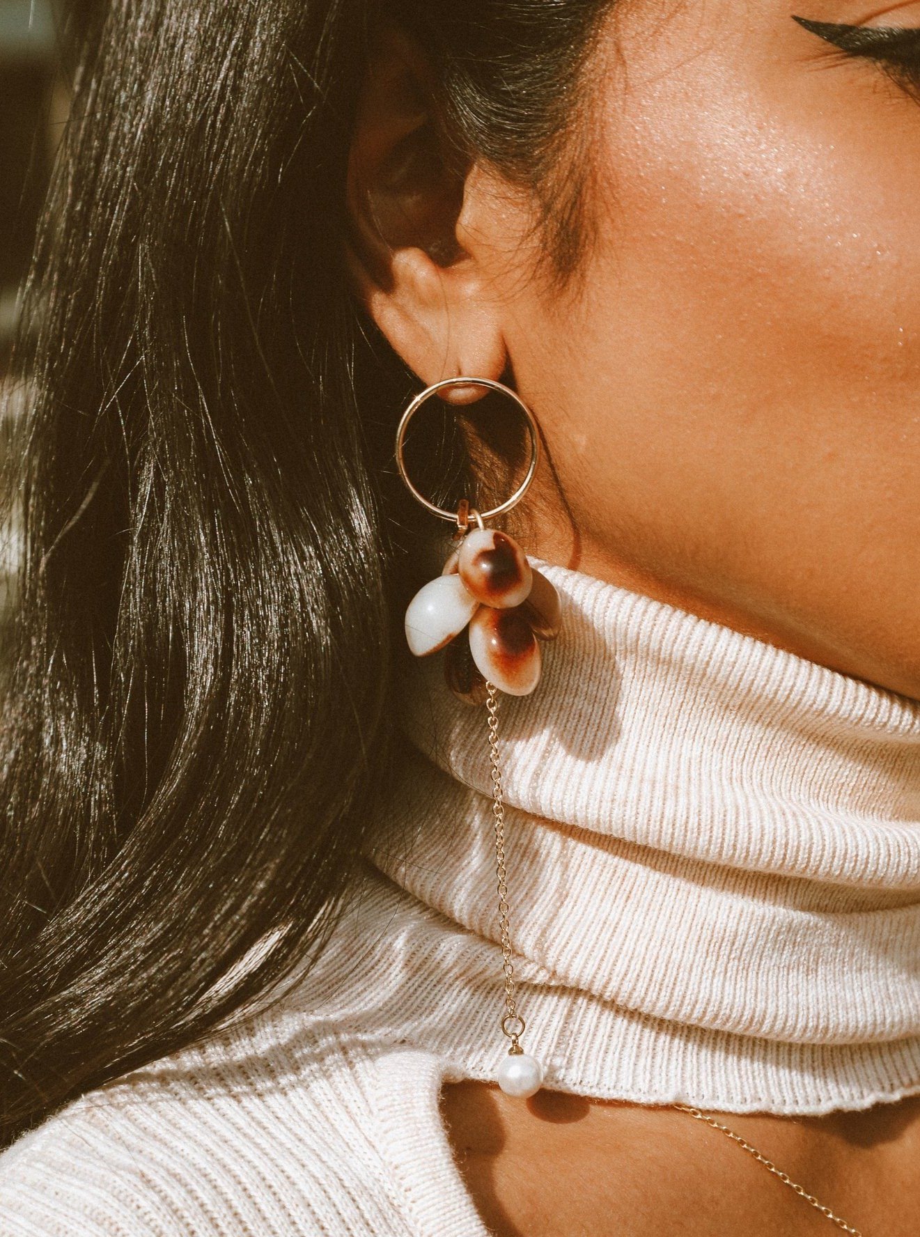 Elegant Look and Dangle Tortoiseshell Earrings featuring gold tone, pearlized accents, and shell charms.