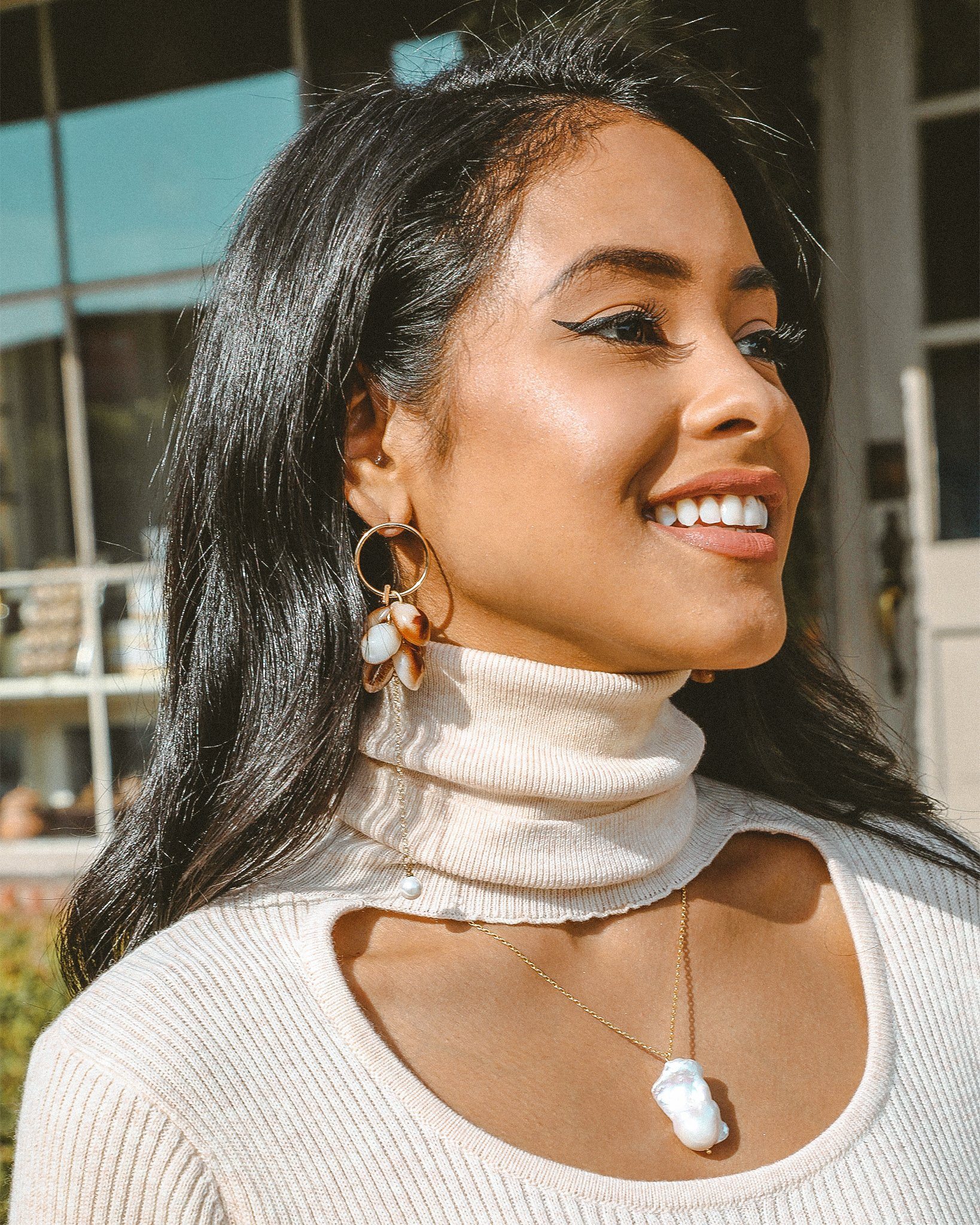 Elegant Look and Dangle Tortoiseshell Earrings featuring gold tone, pearlized accents, and shell charms.