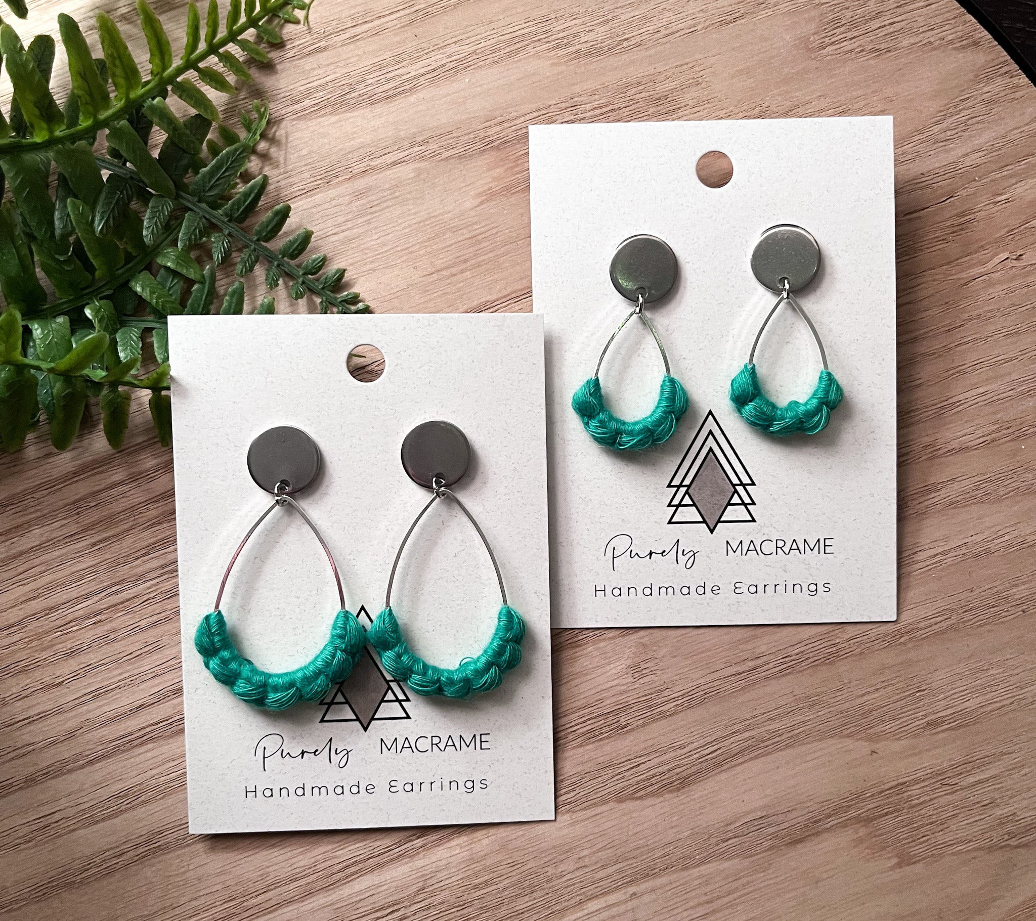 A pair of matching earrings for a mother and daughter, featuring one small and one larger pair, designed in a stylish green color.