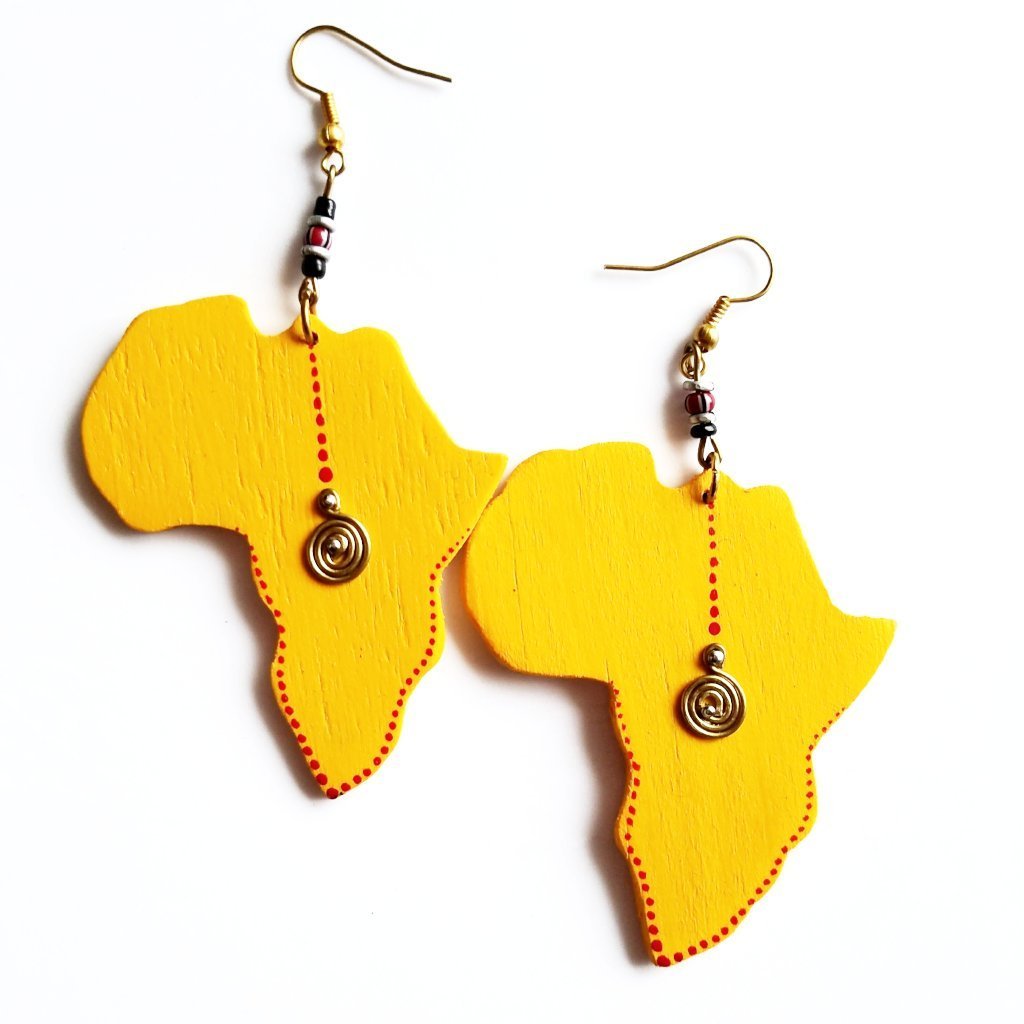 A pair of vibrant yellow wooden earrings shaped like the African continent, showcasing intricate craftsmanship.