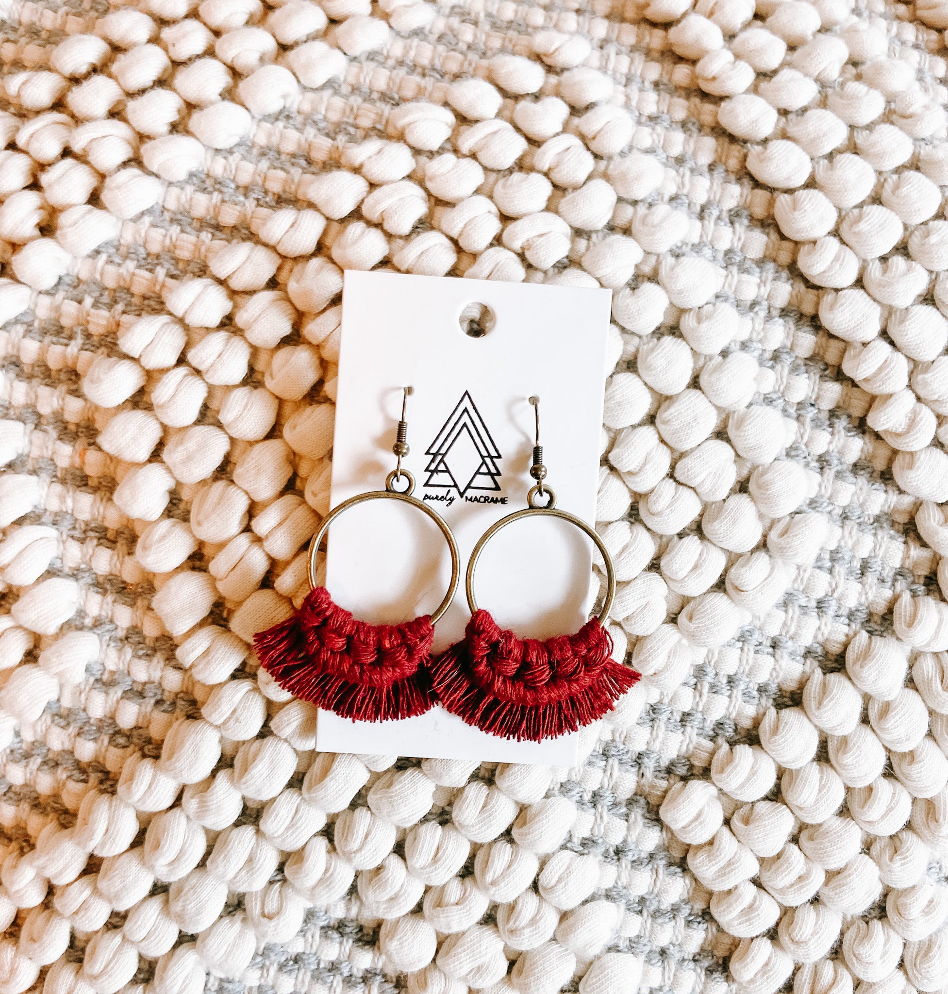 A pair of elegant Merlot rounds made from 100% macrame cotton, showcasing a rich color and lightweight design.