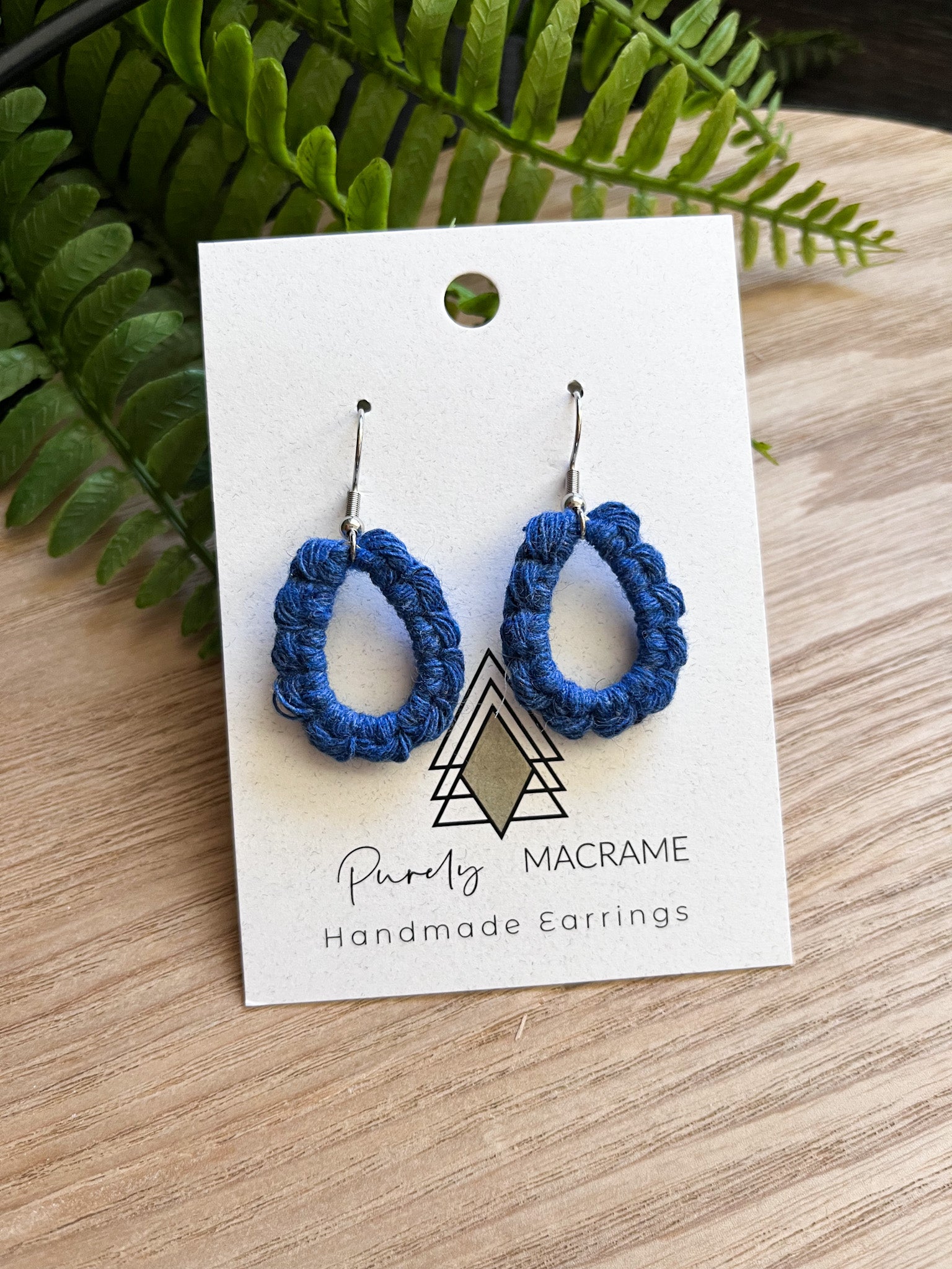 A pair of lightweight Mini Teardrop earrings made from 100% macrame cotton, available in various colors.