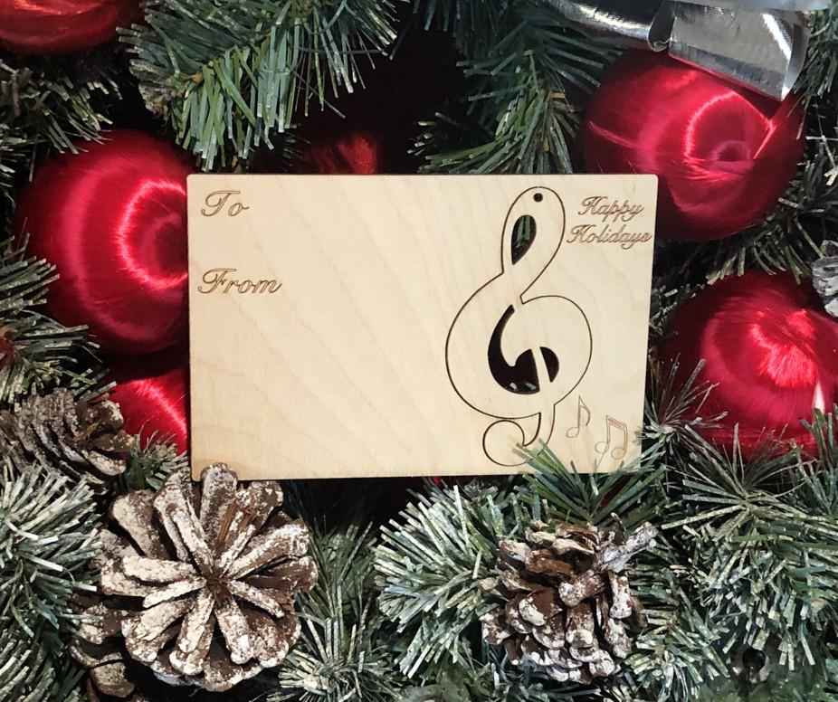 Music Note Holiday Ornament Card #9008 made from sustainably sourced wood, featuring a music note design, perfect for Christmas gifting and decoration.