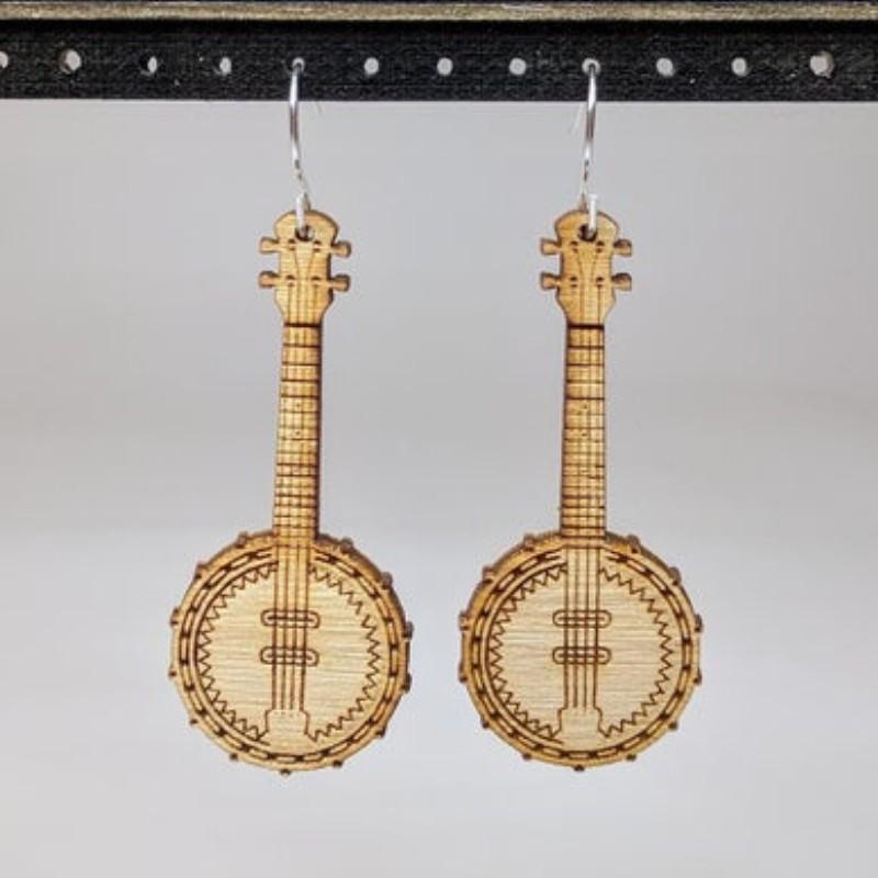 A pair of lightweight wooden earrings shaped like various musical instruments, including guitars and drums, with sterling silver ear wires.