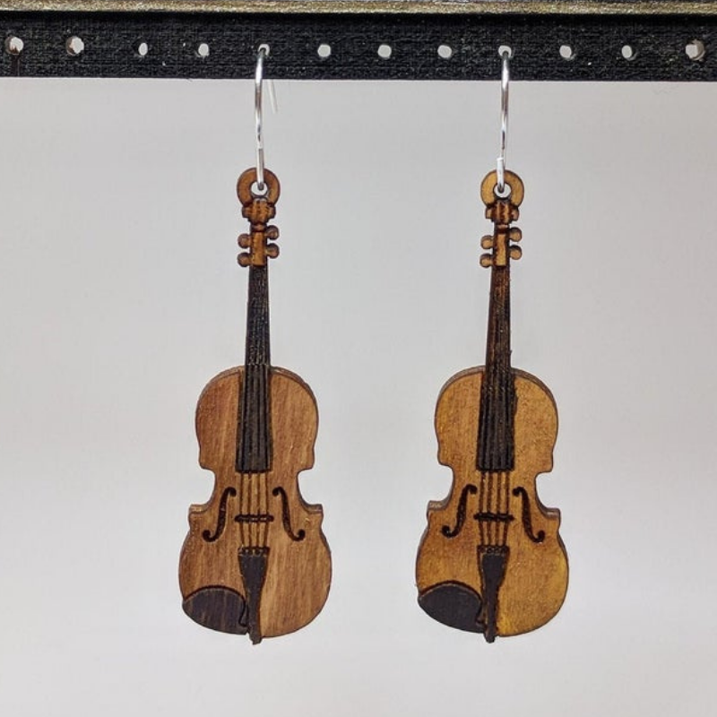 A pair of lightweight wooden earrings shaped like various musical instruments, including guitars and drums, with sterling silver ear wires.