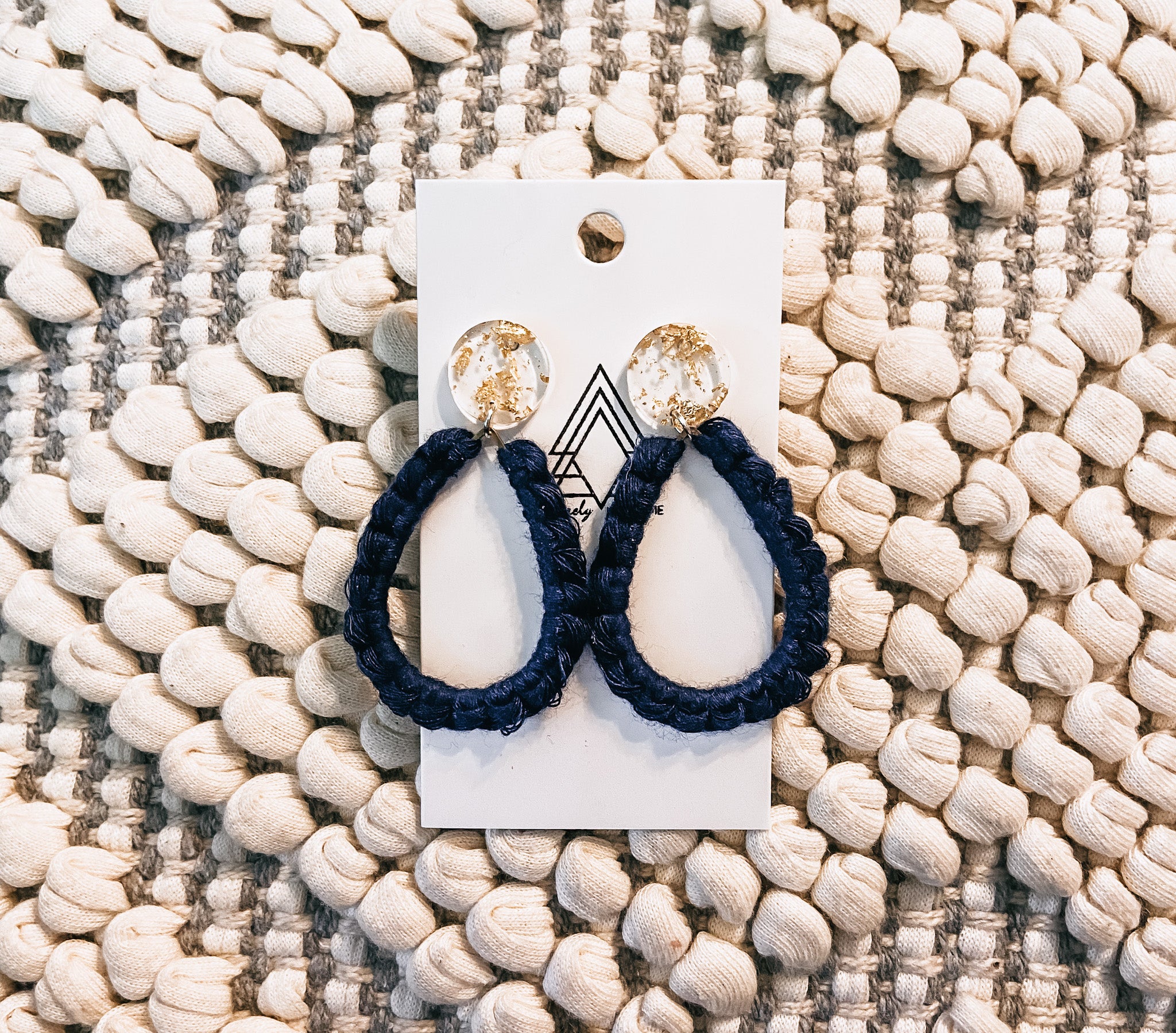 A pair of Navy Gems made from 100% macrame cotton, showcasing a lightweight and stylish design in a rich navy color.